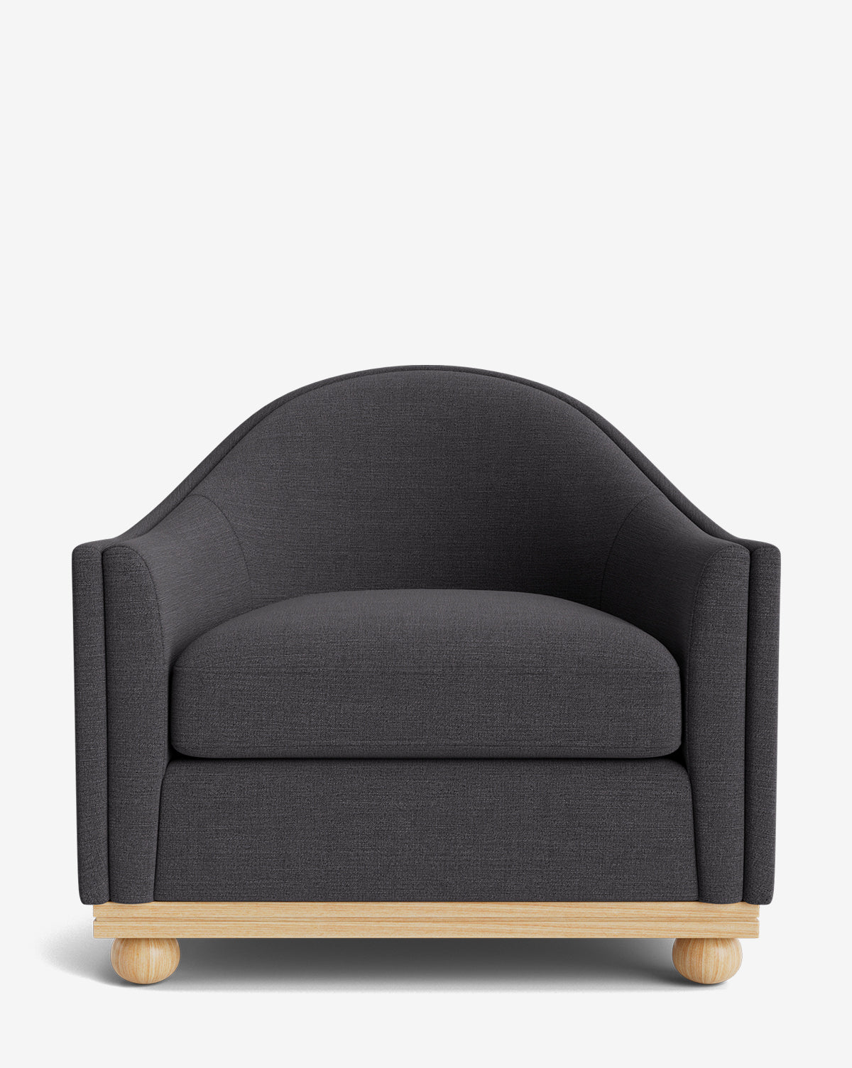 The Test Bunnell Lounge Chair (Copy) features a modern dark gray design with rounded arms and backrest, a thick seat cushion, and a light wooden base with spherical feet, shown against a plain white background by McGee & Co.