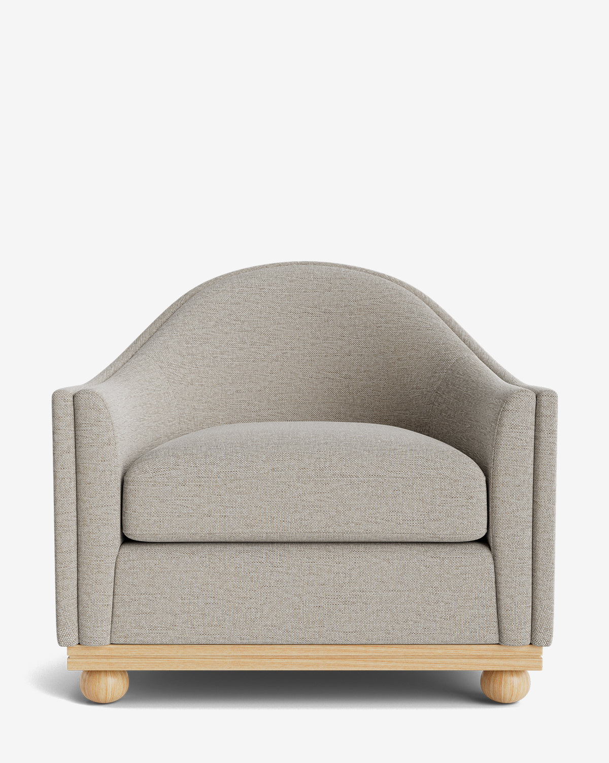 The Test Bunnell Lounge Chair (Copy) features light gray upholstery, a curved backrest, wide cushioned seat, and round wooden legs—a modern made-to-order piece shown against a white background by McGee & Co.