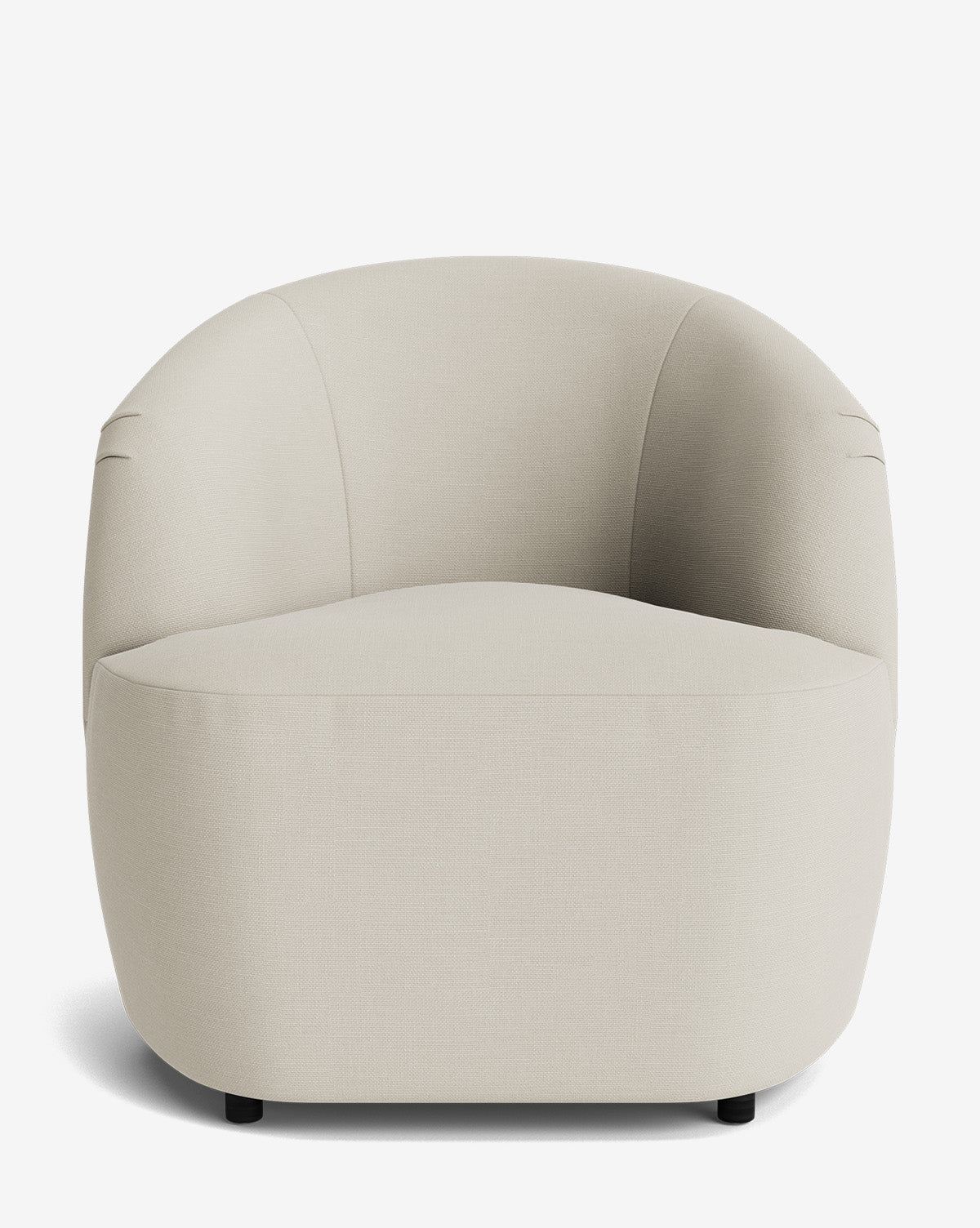The Byron Chair features a curved back and rounded arms, upholstered in light beige fabric with a seamless seat and hidden legs, displayed on a plain white background by McGee & Co.