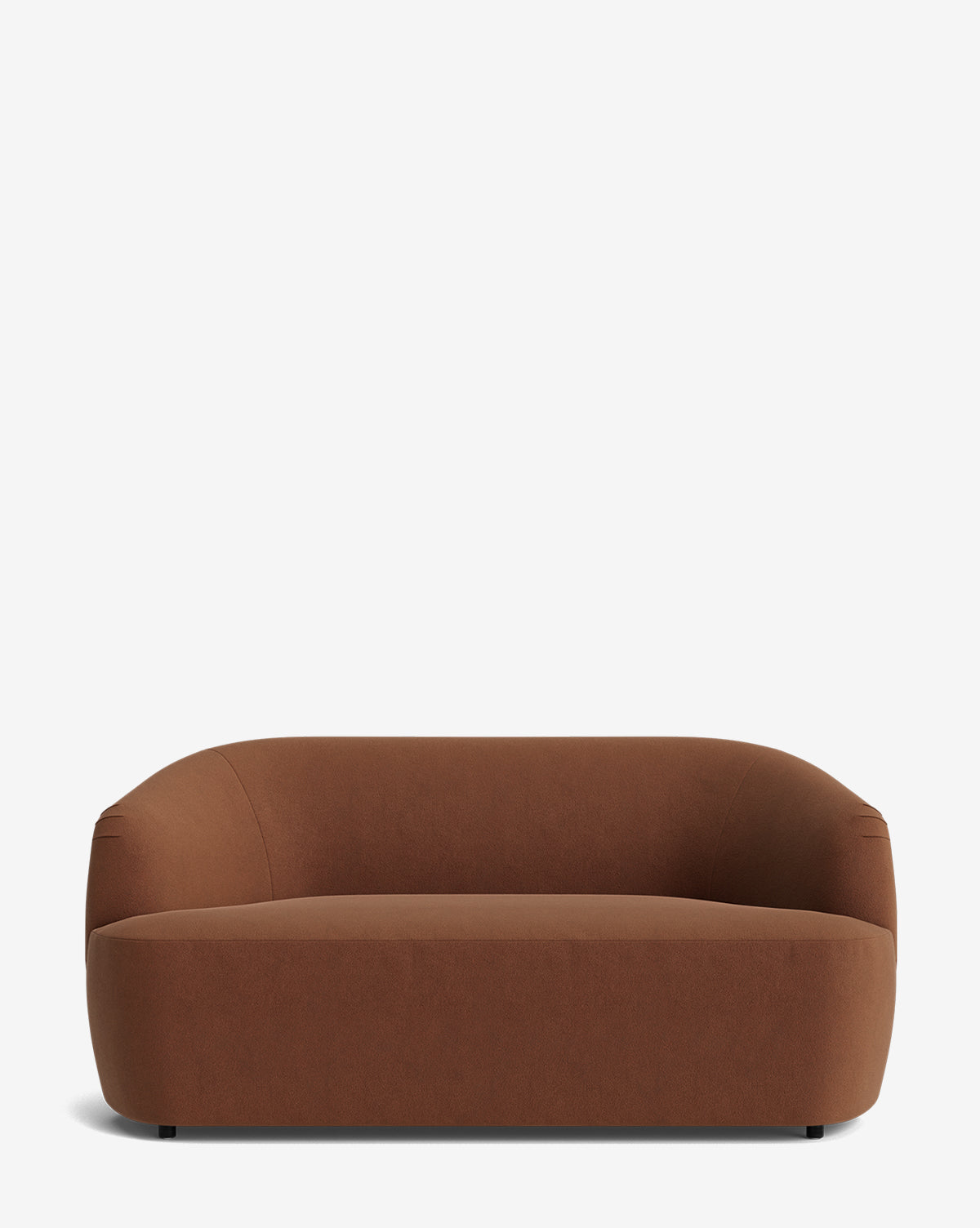 The Byron Settee 68 is a modern, minimalist brown settee with a low curved back and wide seat, upholstered in smooth fabric, shown against a plain white background by McGee & Co.