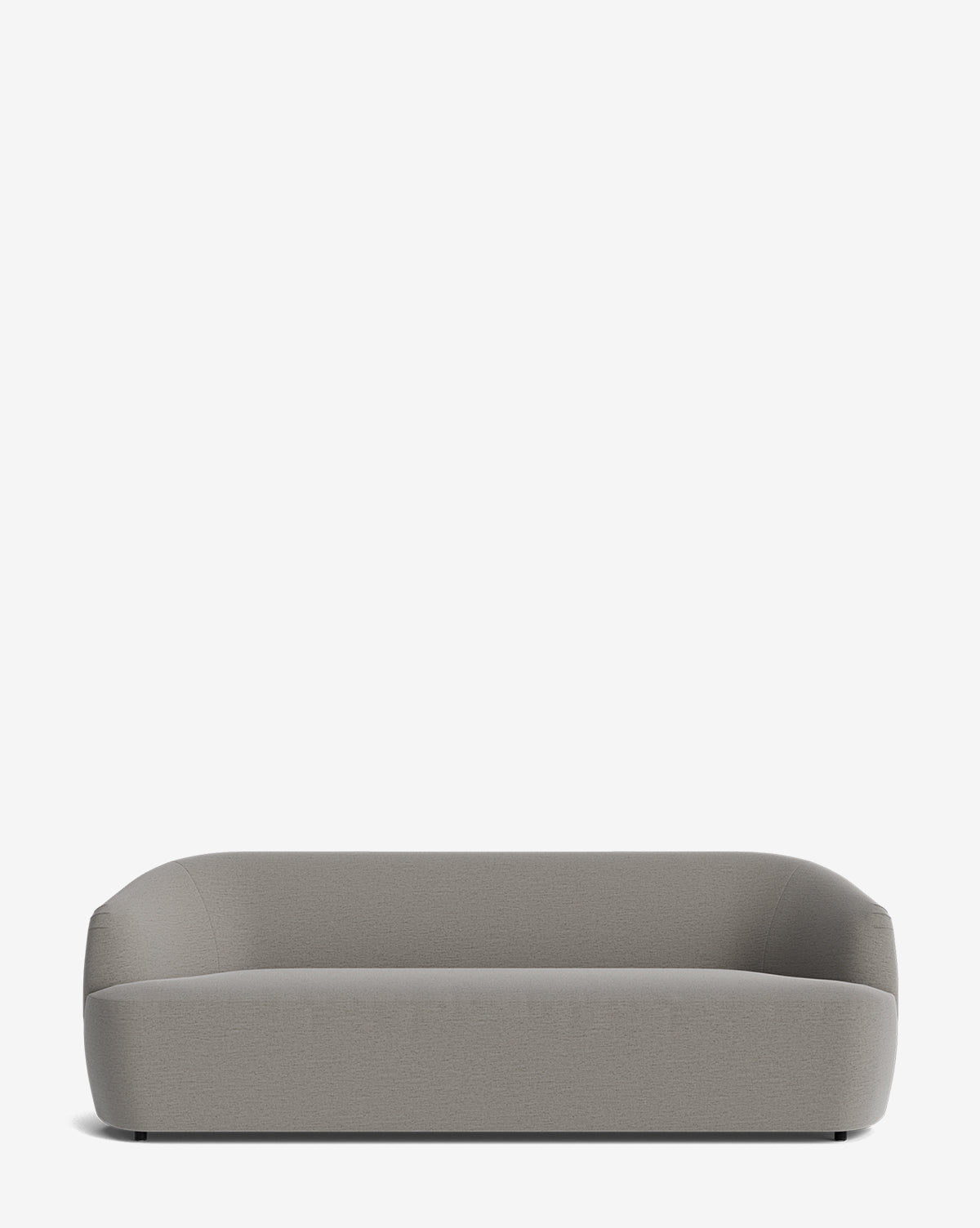 The Makerspalm Byron Sofa 96 features a modern, minimalist design with a curved back, rounded edges, low profile, and light gray custom fabric, shown against a plain white background. Vendixs