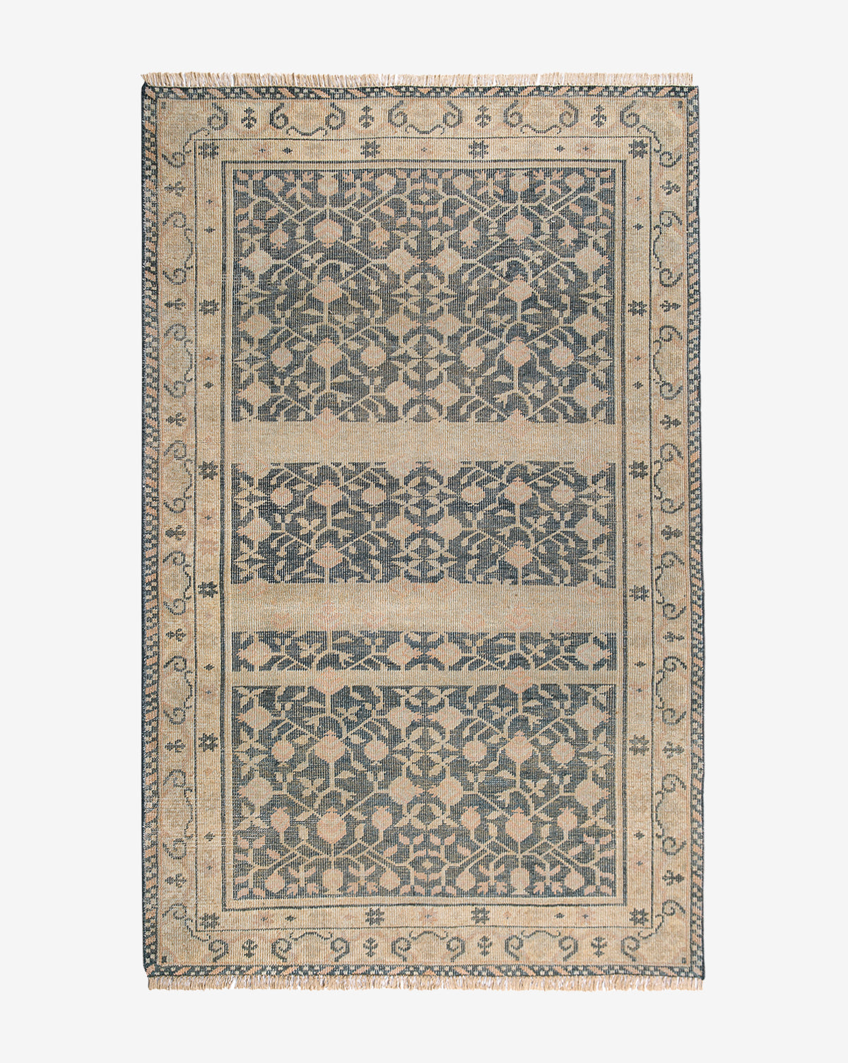 The Campanella Hand-Knotted Wool Rug features a rectangular shape with a detailed, symmetrical floral and vine pattern in dark blue and beige, plus a decorative border and fringe edges inspired by traditional textiles, by Vendixs