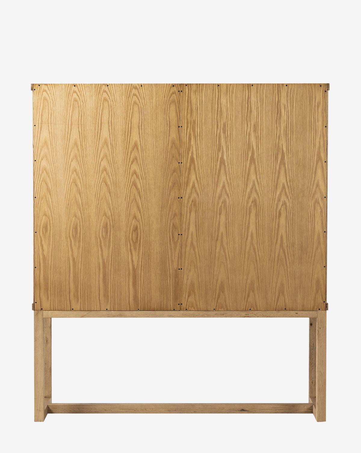 The Carrington Cabinet is a minimalist cabinet with a natural worn oak finish, vertical wood grain patterns, and simple construction on an open rectangular wooden base, by Vendixs