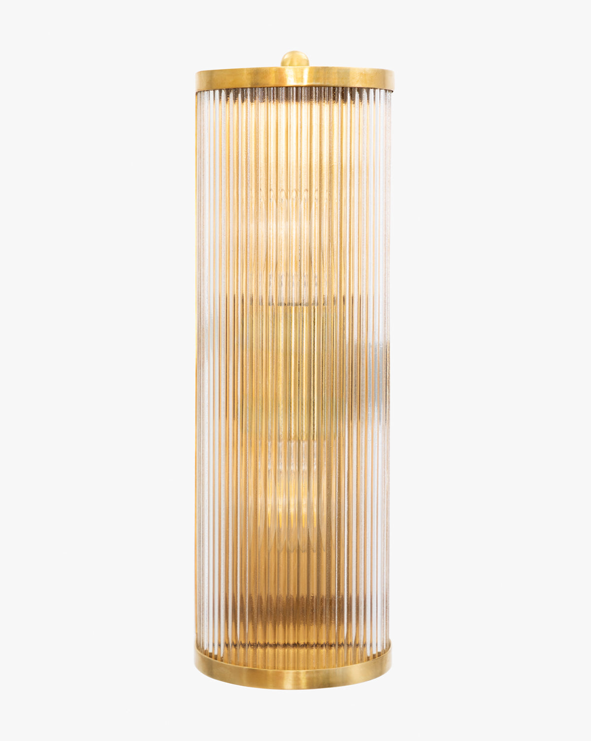 The Cavendish Sconce by Meredith (China) Ltd features an antique brass frame with vertical fluted glass panels, emitting a warm light. Vendixs