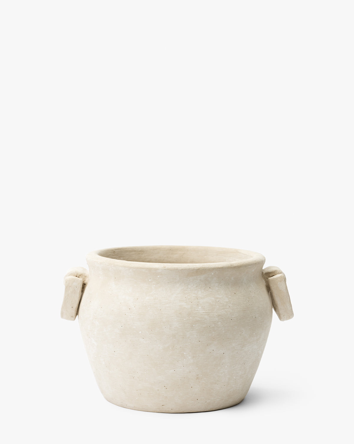 The Chelsea Planter by Terra Cotta Art Works, Inc. is a simple round beige pot featuring two small rectangular handles on each side, shown against a plain white background. Vendixs