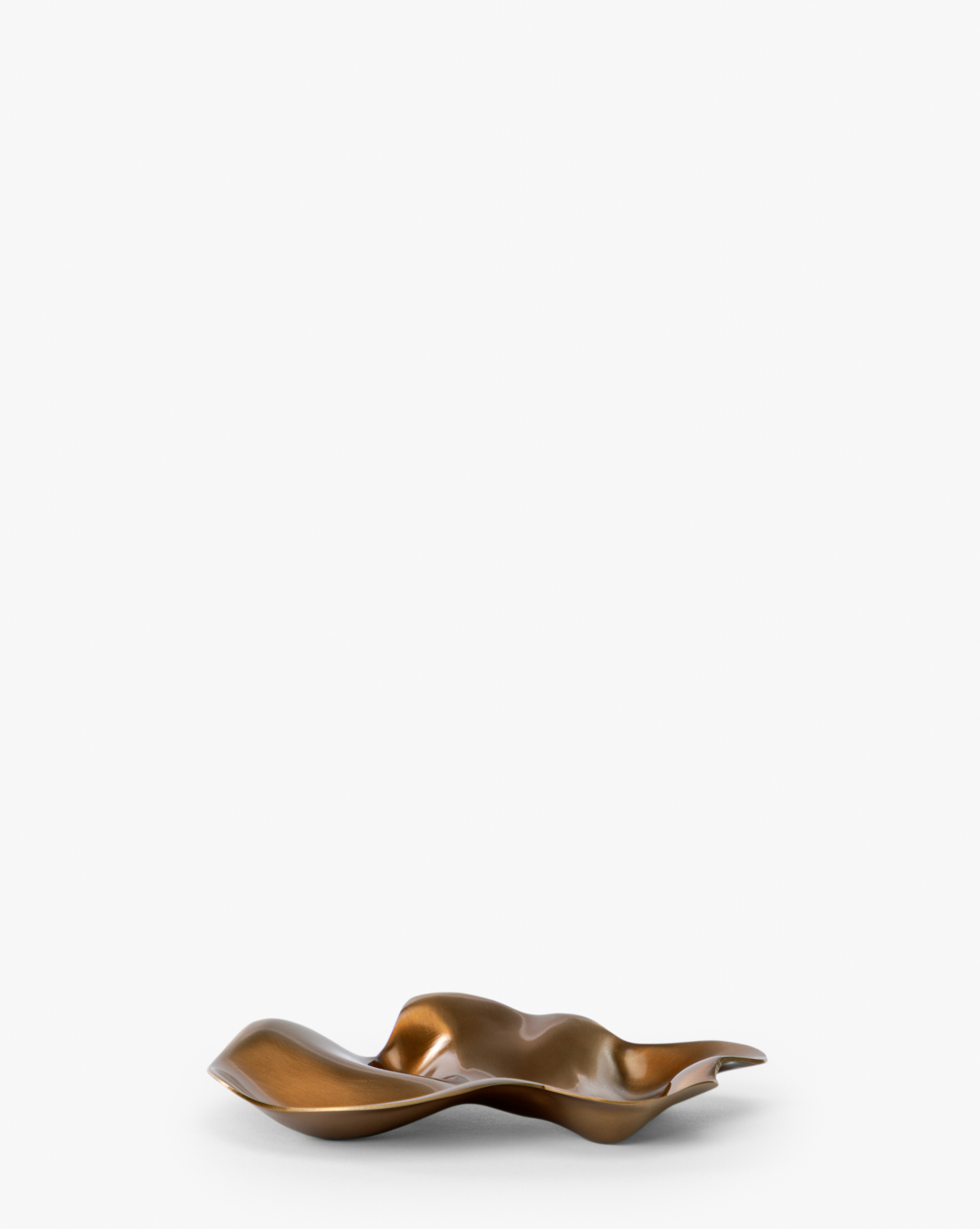 The Chiffonner Metal Object, featuring a wavy, bronze-colored form with a metallic finish and irregular shape, exemplifies modern artistry against a plain white backdrop, by Vendixs