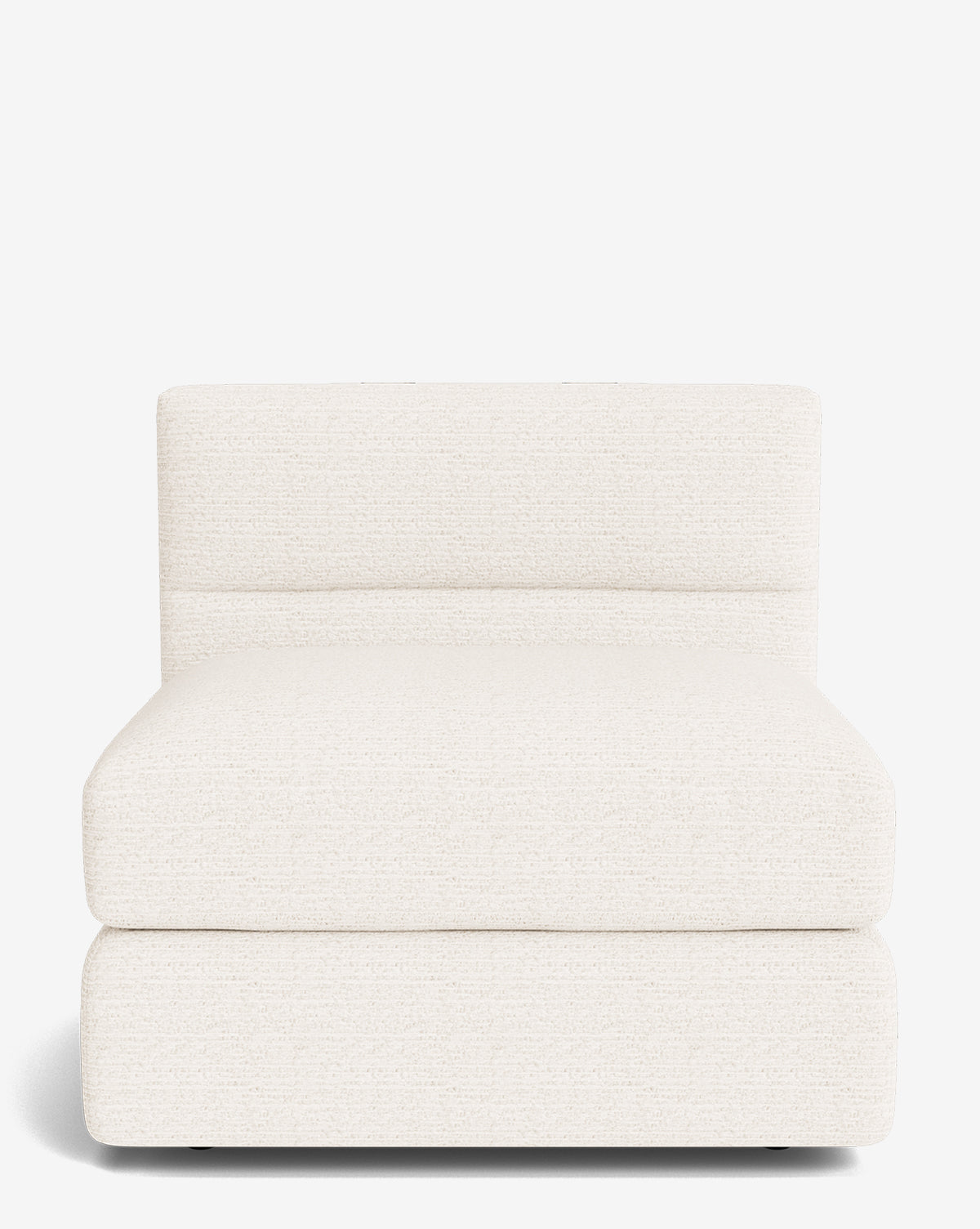 The Claremont Modular Armless Chair by Makerspalm features a wide seat and low backrest, upholstered in off-white textured fabric with a vintage-inspired modern design, set against a white background. Vendixs