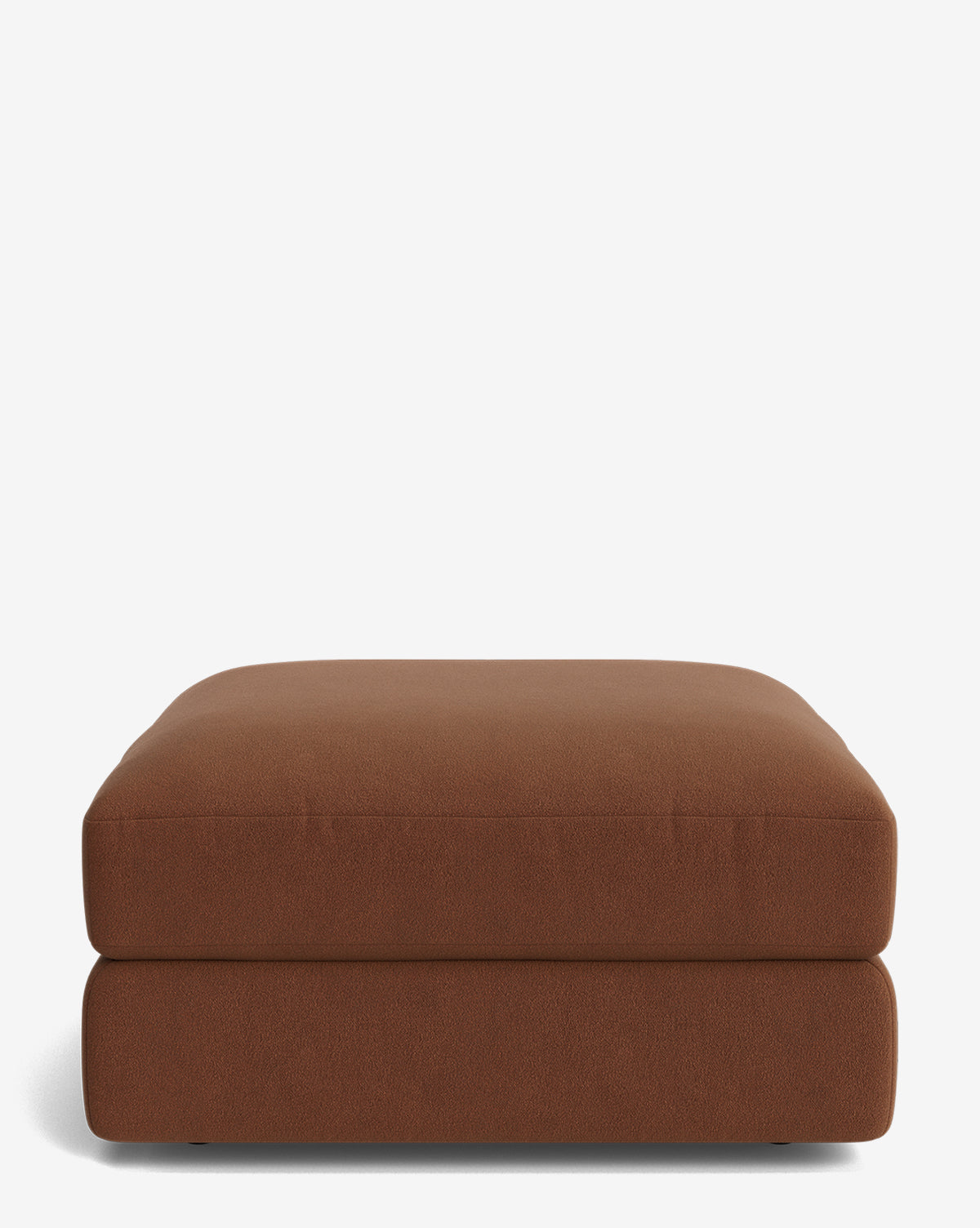The Claremont Modular Ottoman by Makerspalm is a square, brown vintage-inspired piece with a cushioned top and rounded edges, displayed against a plain white background. Vendixs