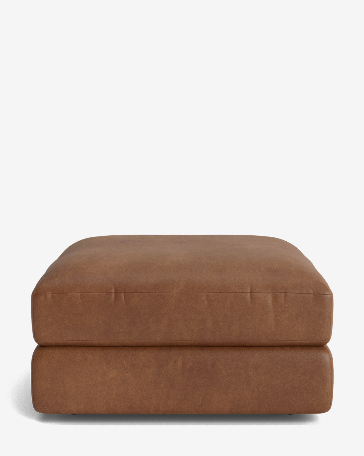 The Claremont Modular Ottoman by Makerspalm is a large, square, brown leather piece with smooth flat cushioning and a minimalist vintage-inspired design, set against a plain white background. Vendixs