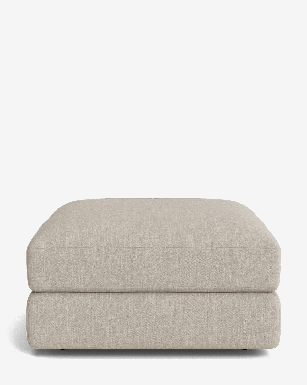 The Claremont Modular Ottoman by Makerspalm is a square, light beige piece with a minimal modern design, soft cushion top, and clean lines—ideal for modular setups. Vendixs