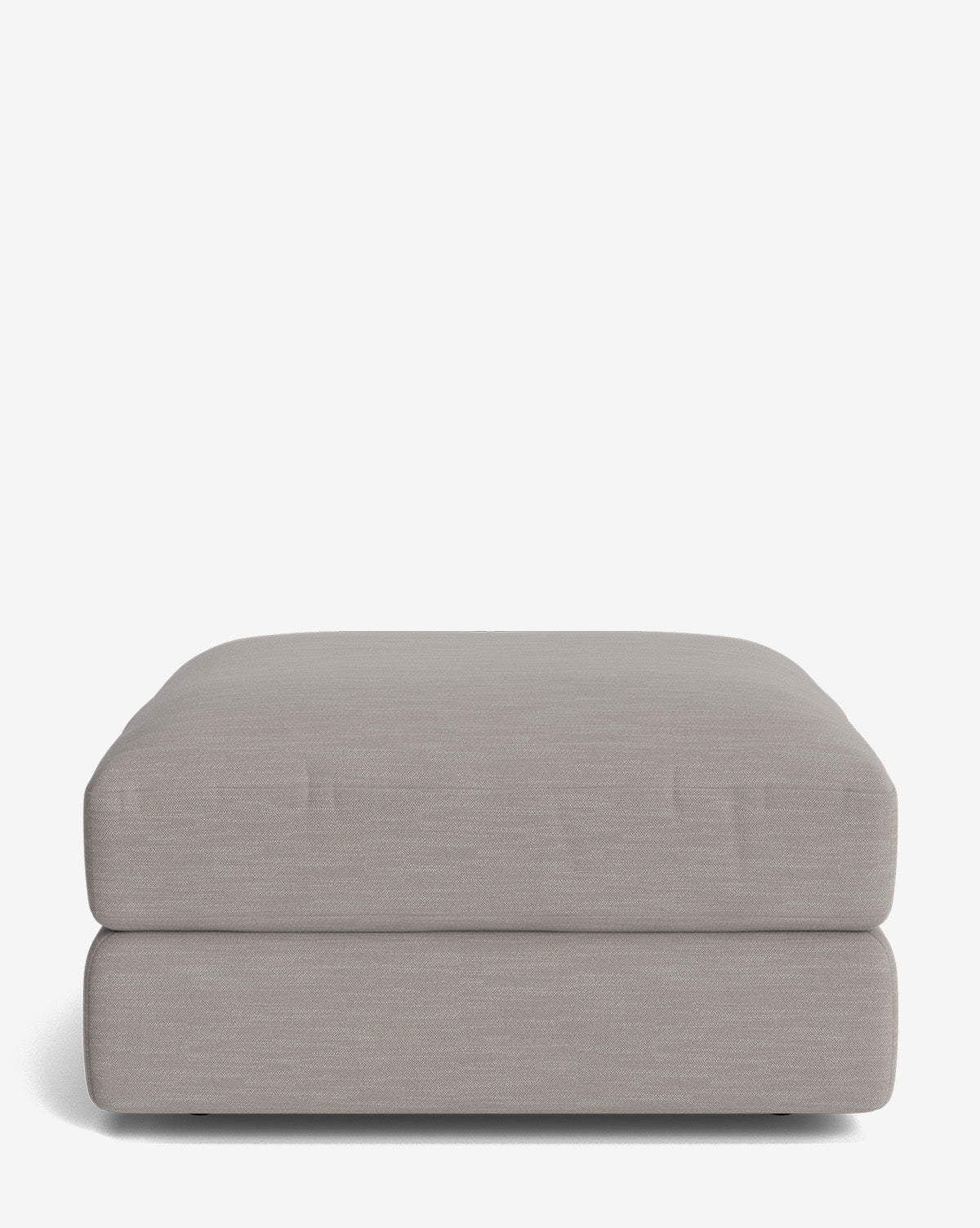 The Makerspalm Claremont Modular Ottoman is a large, rectangular piece in light gray with a cushioned top and modern design, displayed against a plain white background by Vendixs