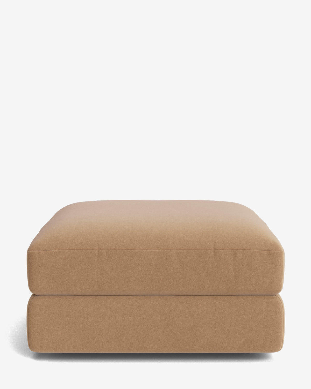The Makerspalm Claremont Modular Ottoman features a rectangular design in light brown with a soft, cushioned top and smooth fabric upholstery, shown against a plain white background. Vendixs