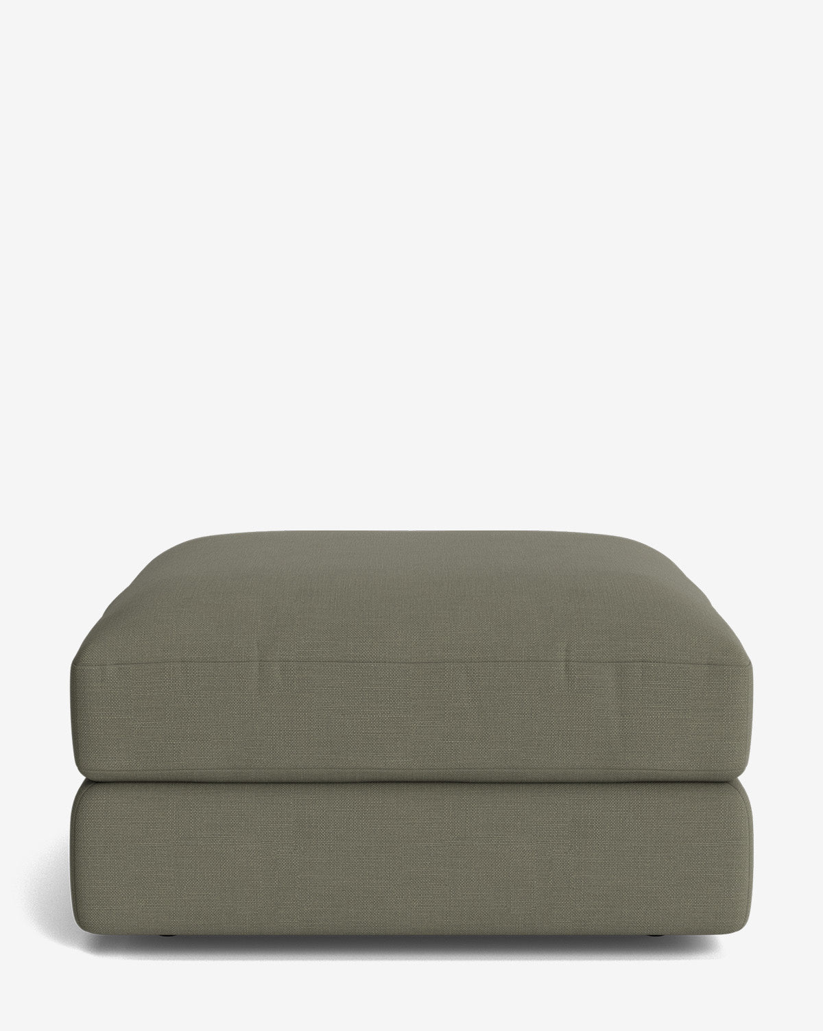 The Claremont Modular Ottoman by Makerspalm is a large, rectangular piece with muted olive green fabric upholstery, offering a simple modern design and low profile, set against a plain white background, Vendixs