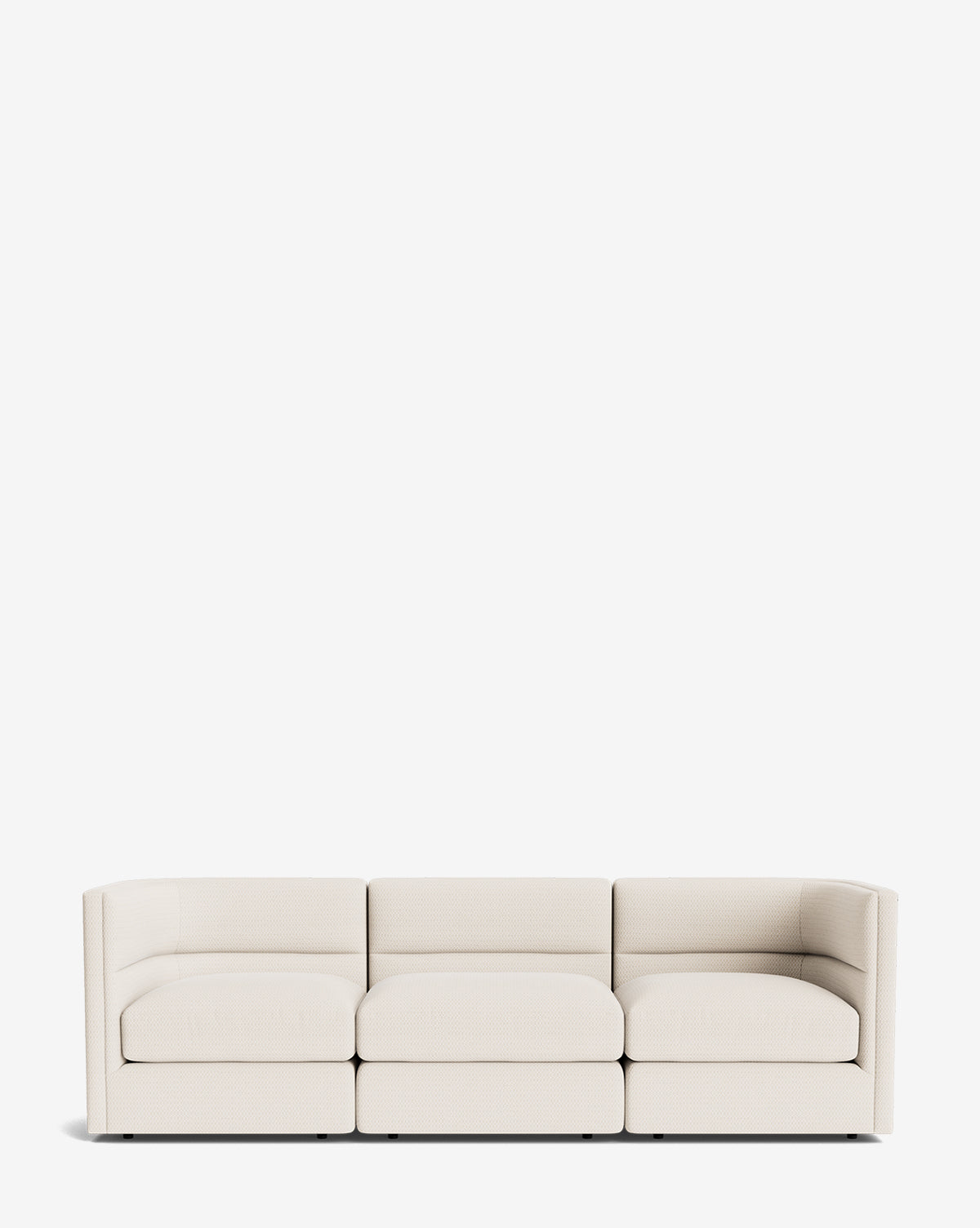 The Makerspalm Claremont Modular Sofa 99 features a modern, vintage-inspired design with a low back and armrests, upholstered in customizable light beige fabric and shown against a plain white background by Vendixs