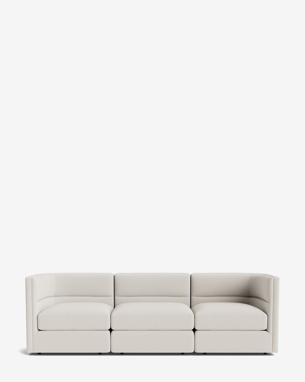 The Makerspalm Claremont Modular Sofa 99 features a modern, minimalist design with three seats, light beige upholstery, low backrests, and square armrests, shown against a plain white background. Vendixs