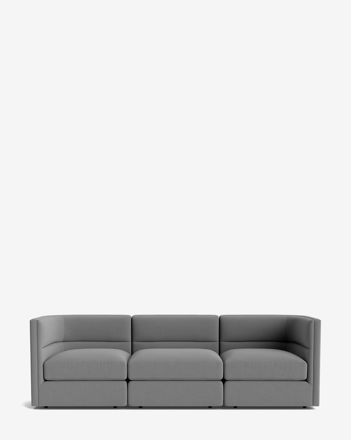 The Makerspalm Claremont Modular Sofa 99 features a modern, minimalist gray design with low armrests and a boxy shape, shown against a plain white background. Vendixs