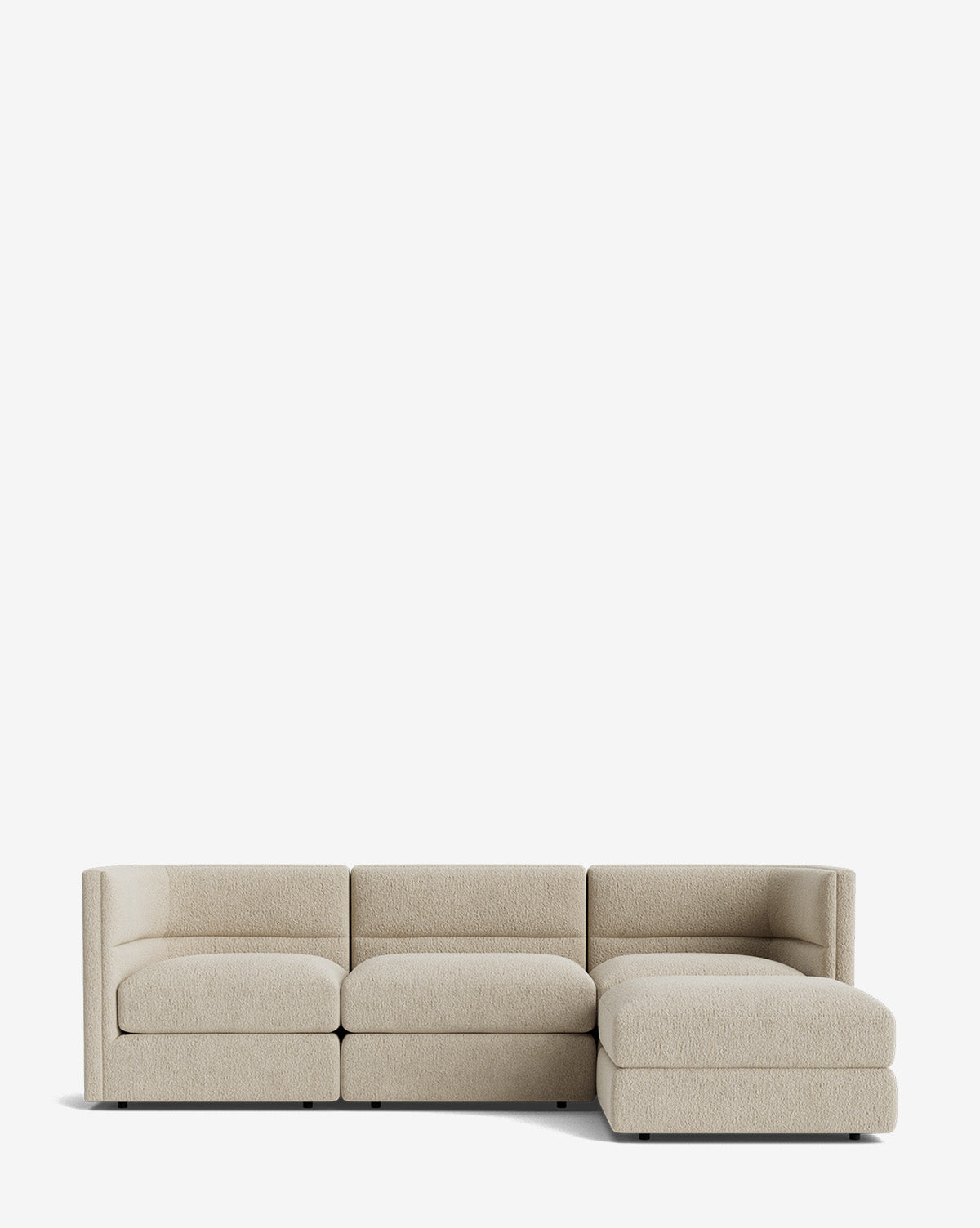 The Makerspalm Claremont Modular Sofa with Ottoman 99 is a modern, light beige sofa with three seat cushions and a right-side chaise, upholstered in textured fabric and shown against a plain white background. Vendixs