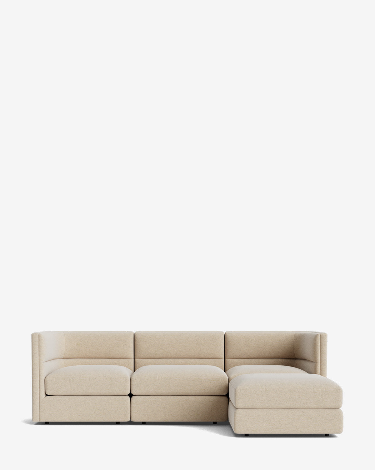 The Makerspalm Claremont Modular Sofa with Ottoman 99 features a modern, low-profile design in light beige fabric, three seats, and a right-side chaise lounge, shown against a plain white background. Vendixs