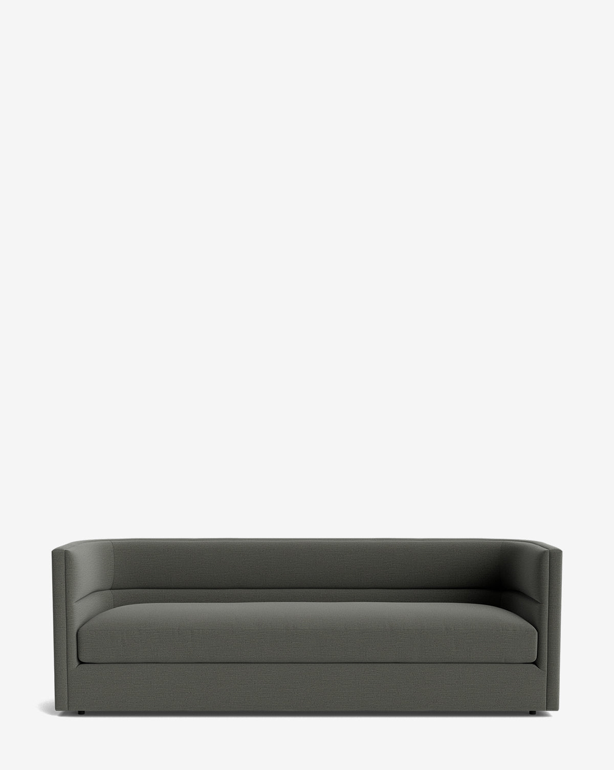 The Claremont Sofa 84 is a modern, dark gray piece featuring a low back and sides, minimalist design, and hidden legs. Upholstered in premium fabric, it is shown against a plain white background, by Vendixs
