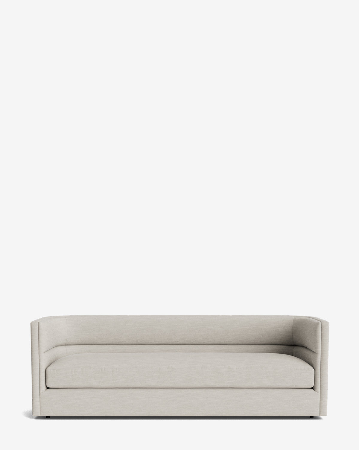 The Claremont Sofa 84 is a modern, minimalist piece in light beige with low arms and a rectangular shape. Set against a plain white background, it features clean lines and high-quality upholstery for lasting comfort by McGee & Co.