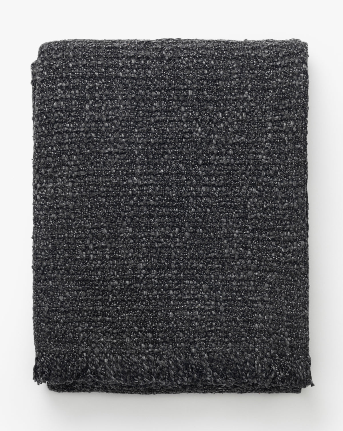 The Clarissa Throw Blanket by Creative Co-op features a soft boucle texture and subtle woven pattern in charcoal, shown neatly folded against a white background, Vendixs
