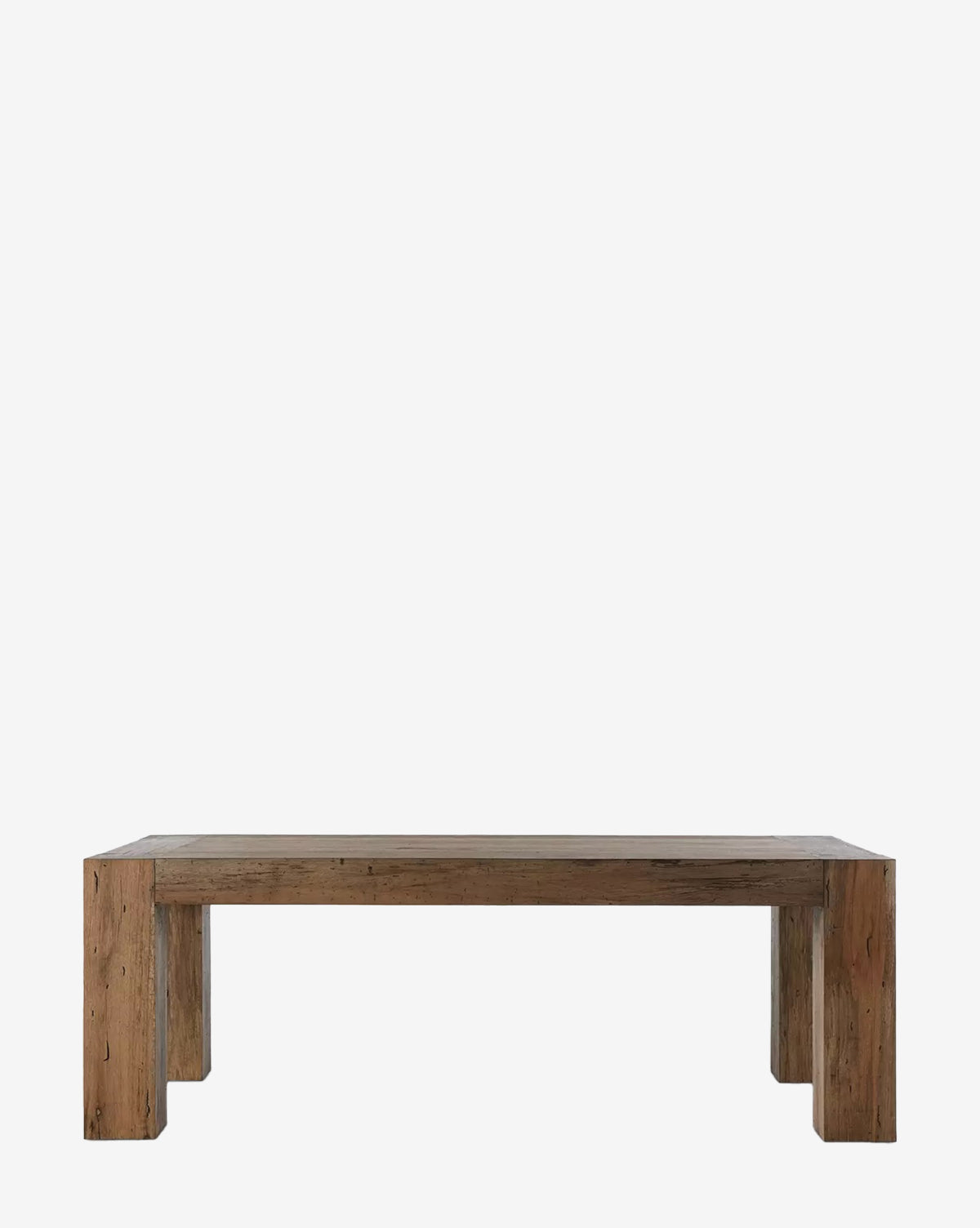 The Clellan Dining Table features a rectangular oak veneer top, thick sturdy legs, and a simple rustic design, shown against a plain white background by McGee & Co.