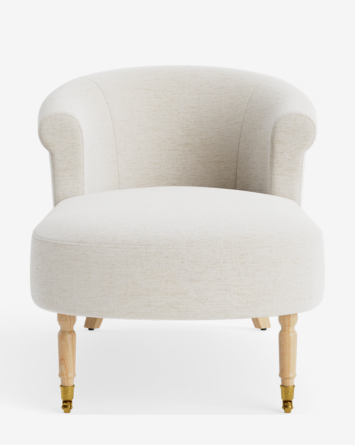 The Clemence Chaise is a cream upholstered accent chair with a curved back, rounded arms, and light wooden legs with brass casters—perfect for customizable comfort, shown against a white background by McGee & Co.