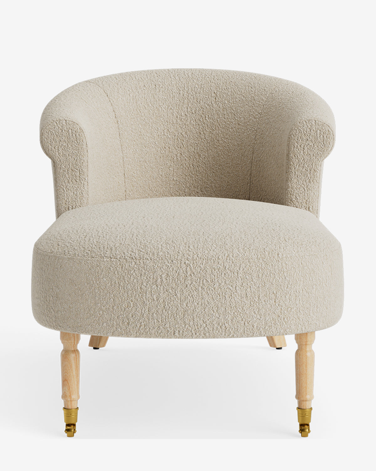 The Clemence Chaise is a cream-colored, textured upholstered armchair with a curved backrest and wooden legs—two with brass caster wheels. Inspired by classic chaise lounges, it offers modern comfort and timeless elegance by McGee & Co.