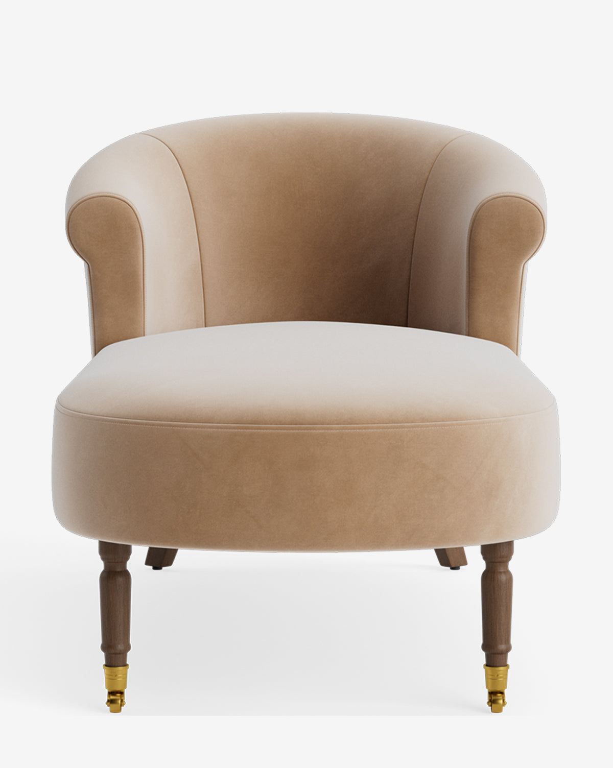The Clemence Chaise is a light beige velvet accent chair with a curved backrest, rounded arms, and wooden legs—front legs have brass caster wheels—delivering customizable style in any space, by McGee & Co.