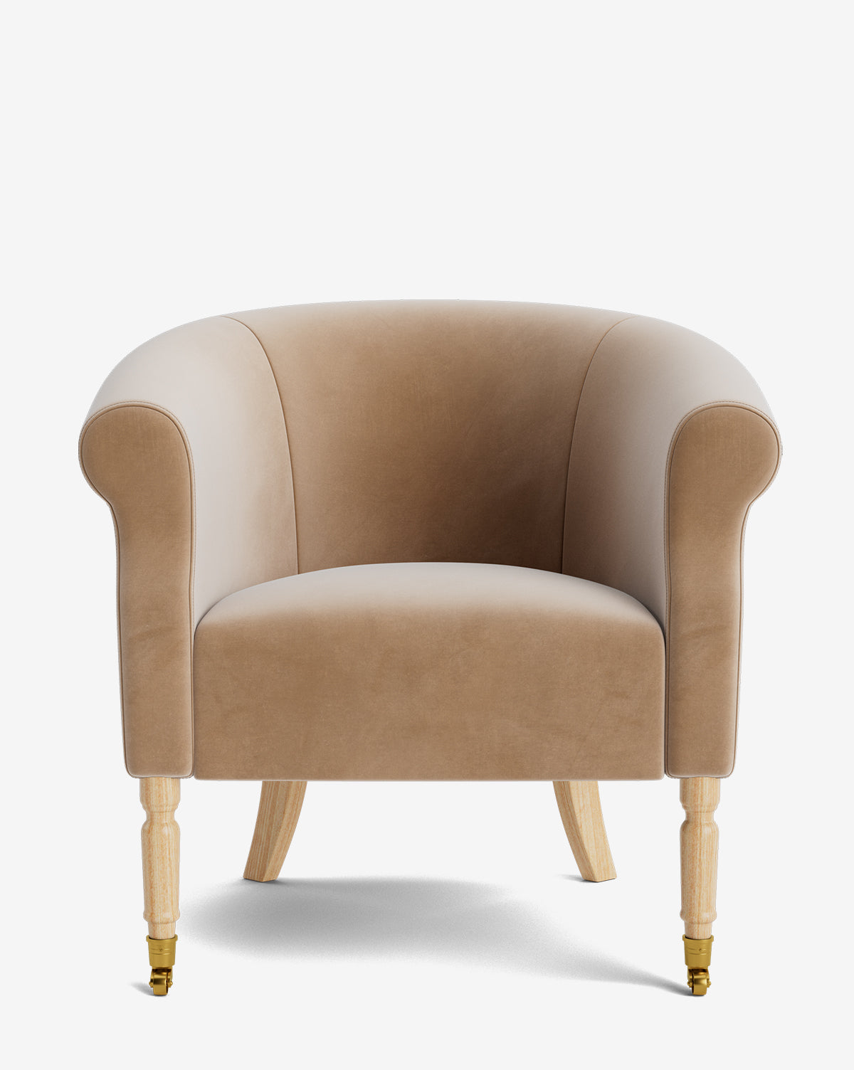 The Clemence Lounge Chair is a beige velvet armchair with rounded arms, a curved backrest, and four light wooden legs with gold castors. Its designer upholstery adds elegance to any living room setting, by McGee & Co.