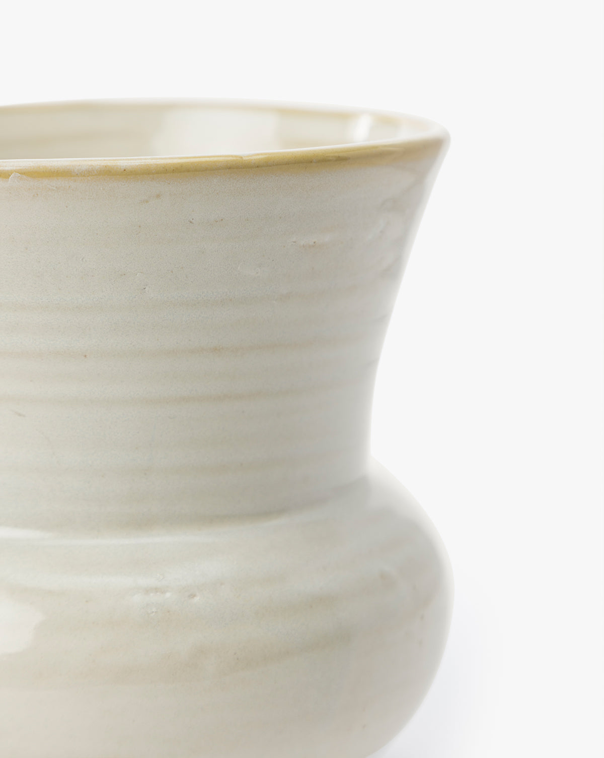 Close-up of the Colchester Planter, showcasing its wide rim, rounded body, smooth ceramic texture, and subtle horizontal lines against a white background—ideal for stylish home décor, by Vendixs