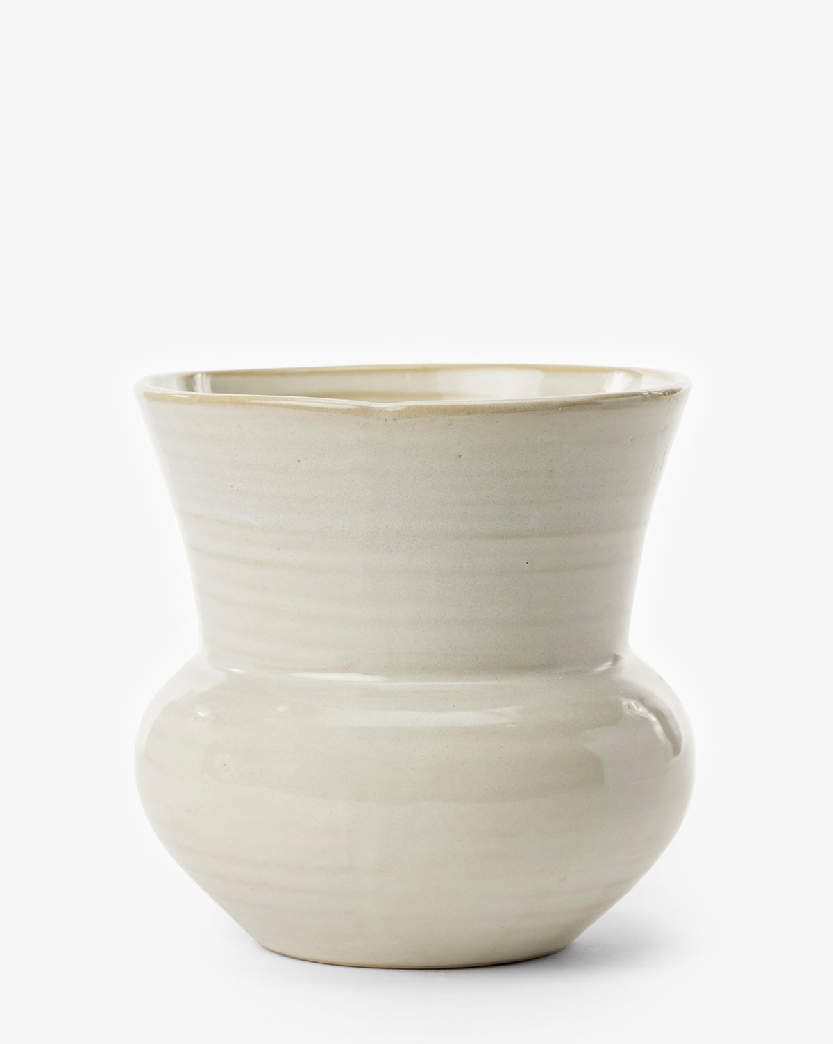The Colchester Planter is a cream-colored ceramic piece with a wide rounded base, flared tapered rim, glossy finish, and subtle horizontal lines—an ideal choice for modern home décor, by Vendixs