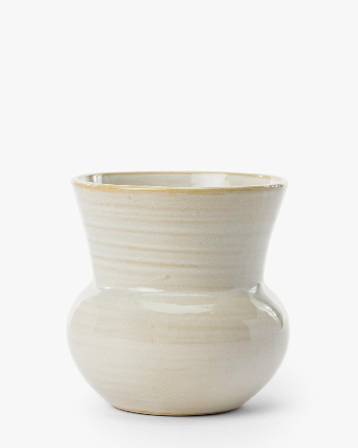 The Colchester Planter features a cream color, rounded base, flared rim, and smooth glossy ceramic finish—an elegant accent for home decor—shown on a plain white background, by Vendixs