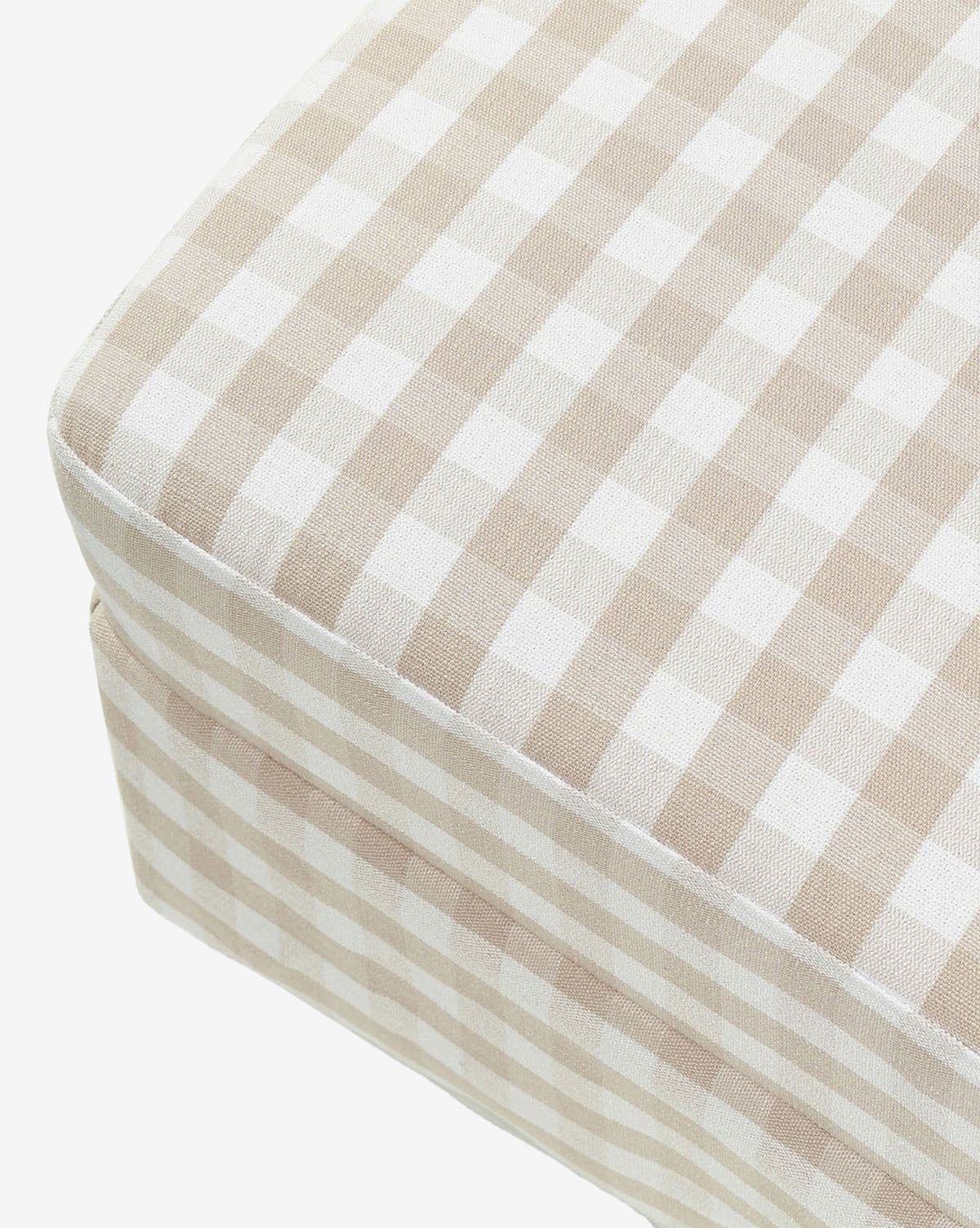The Crawford Gliding Ottoman in Gingham by Million Dollar Baby features beige and white check fabric, adding charm to your nursery or living space. Shown against a white background. Vendixs