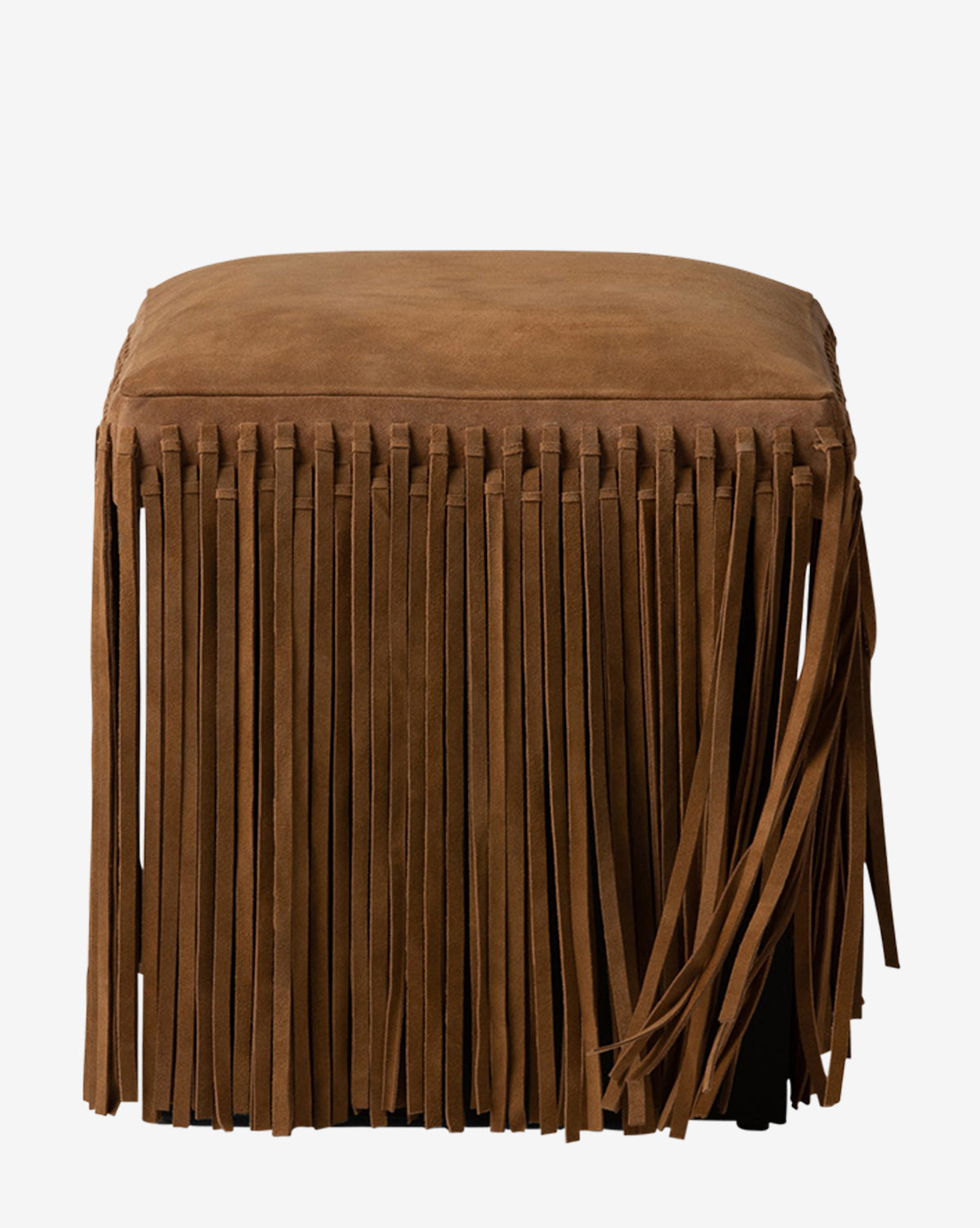 The Damian Ottoman by Made Goods is a square suede ottoman in rich camel with long fringe on all sides for a textured, decorative look, shown against a plain white background. Vendixs