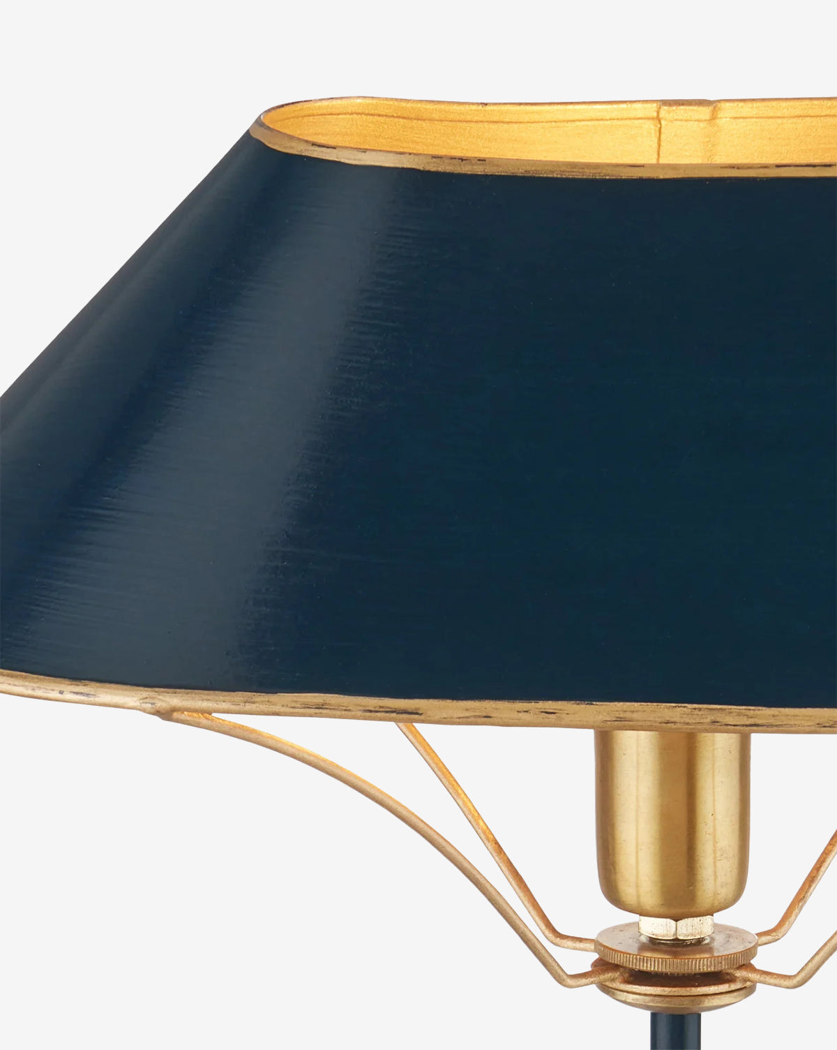 Close-up of the Daphne Navy Table Lamp featuring a dark blue, slightly conical lampshade and a brass fixture, set against a plain white background, by Vendixs