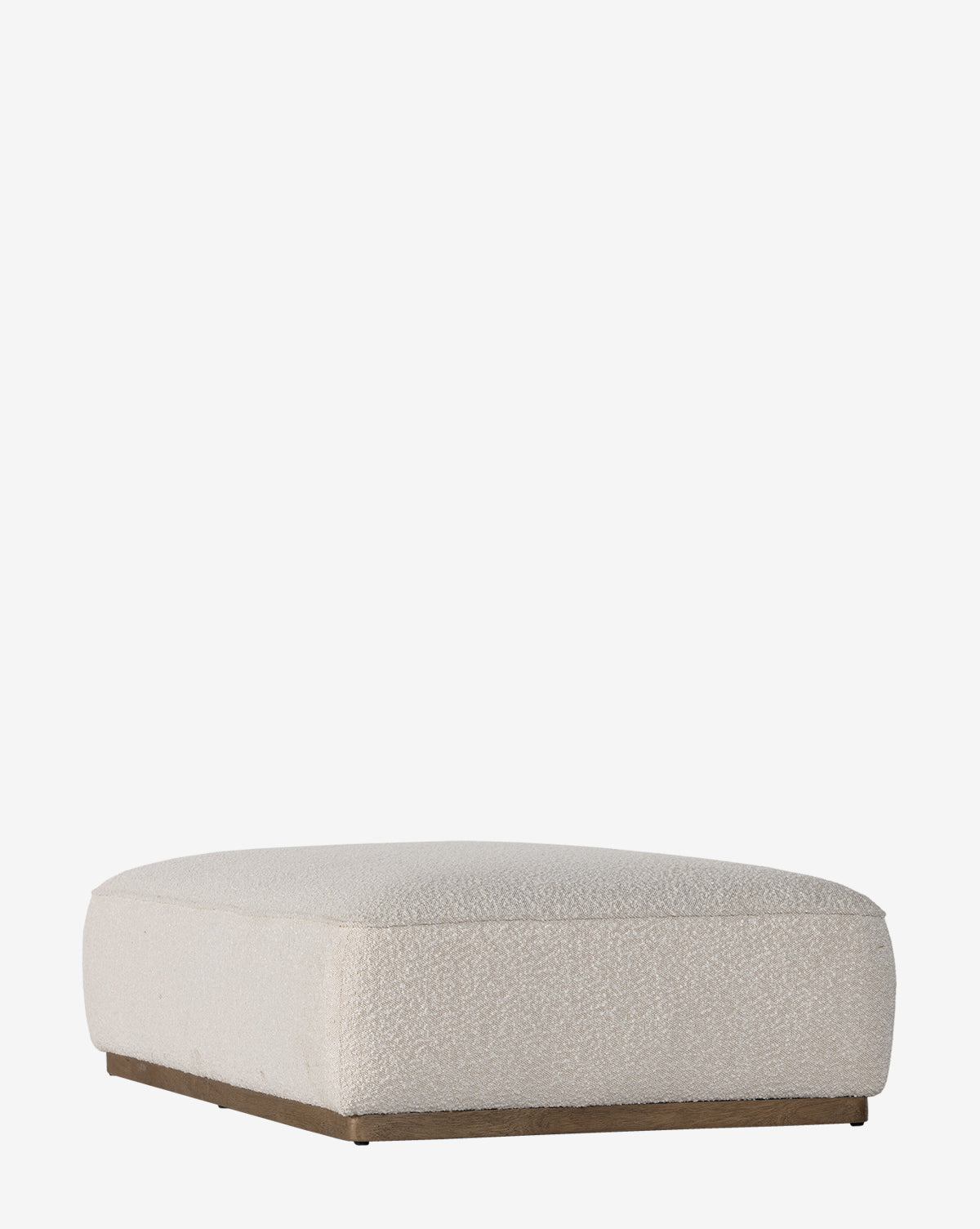 The Dawson Rectangular Ottoman by Four Hands features a low, square design in beige performance fabric with a flat top and slim parawood base, shown against a plain white background. Vendixs