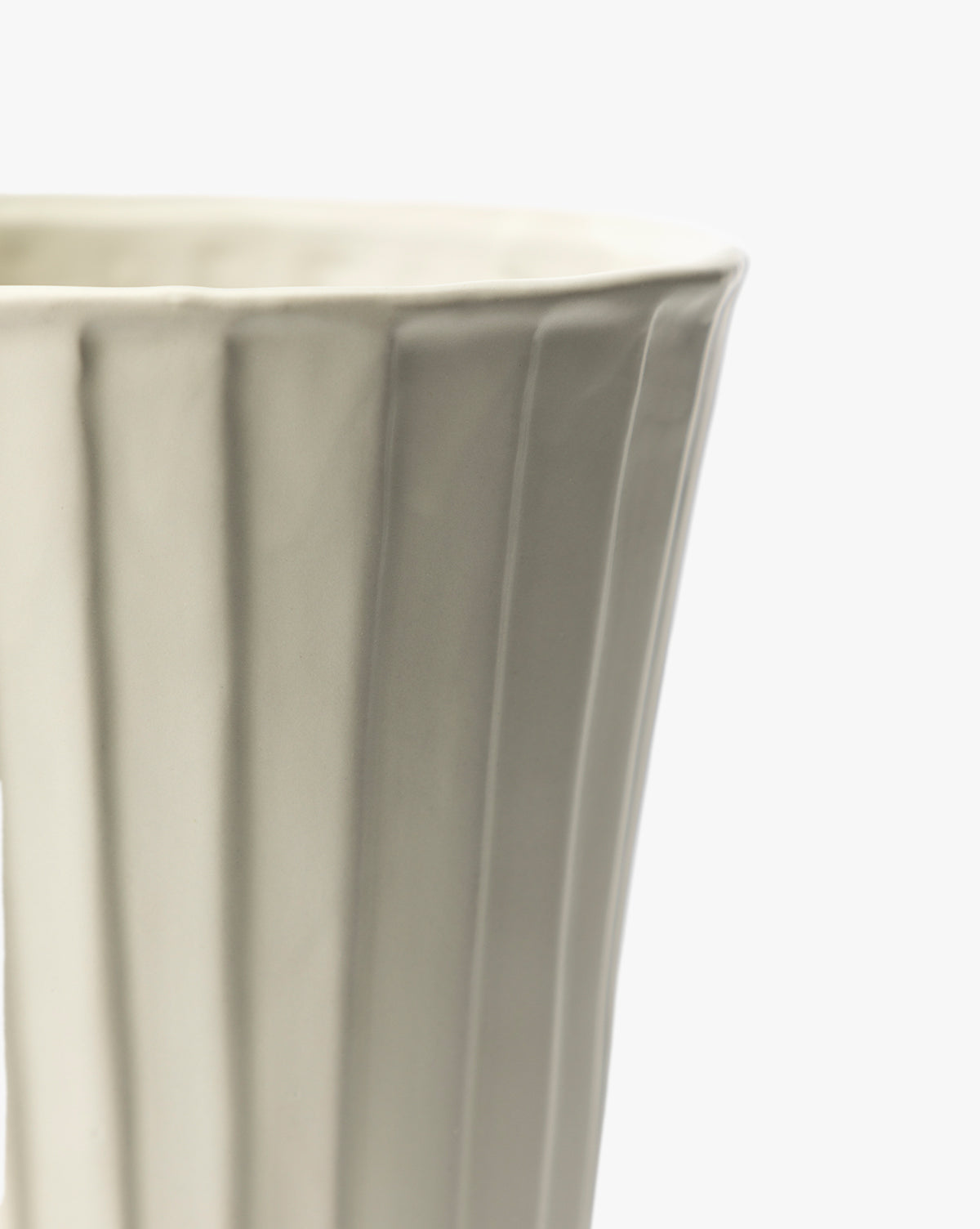 Close-up of the Delphi Footed Vase, featuring a white stoneware body with fluted texture and glossy finish. The image shows only the upper portion and one side, set against a plain white background, by Vendixs