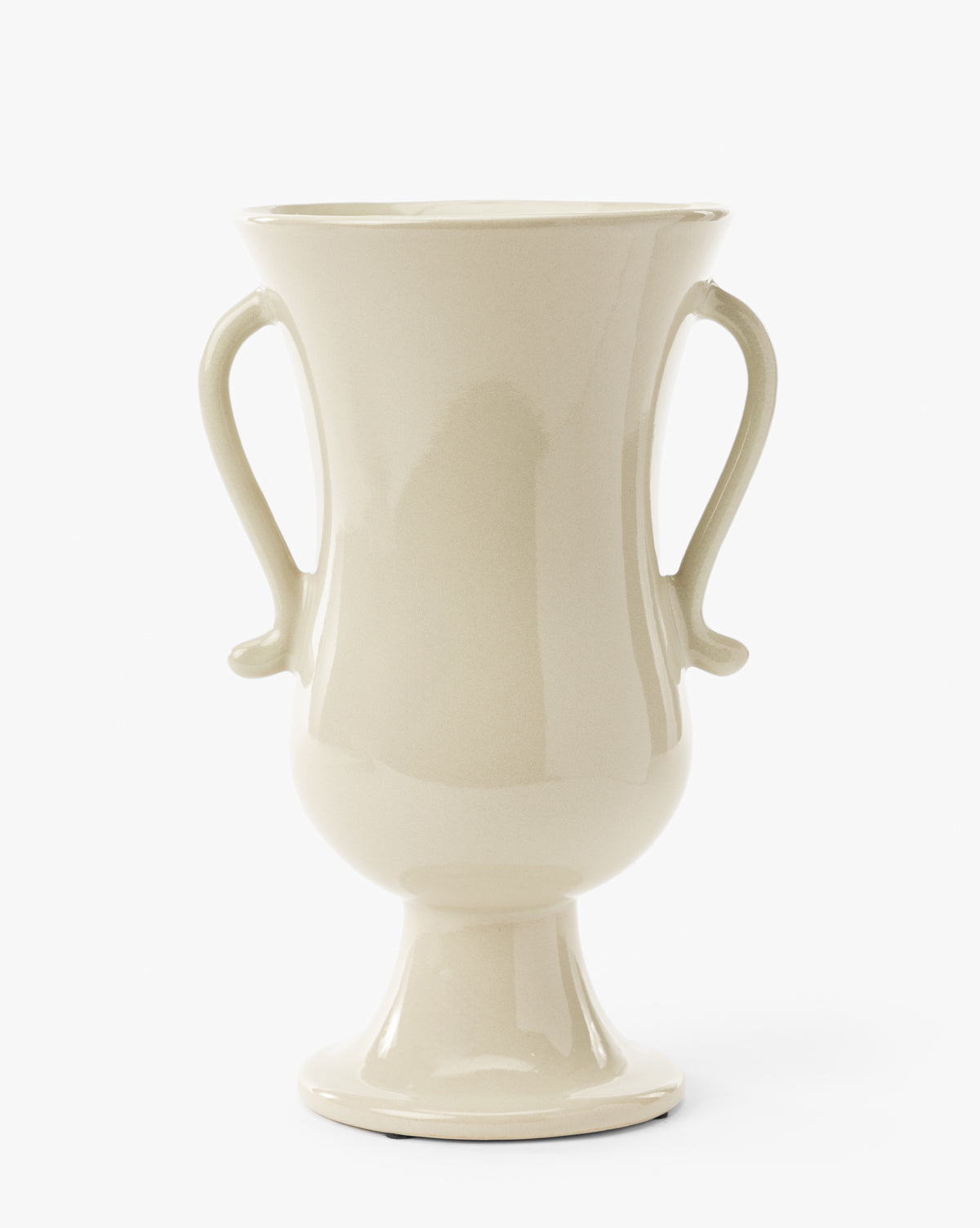 The Delphine Footed Vase is a glossy, cream-colored ceramic piece featuring two curved handles, a wide flared rim, rounded body, and narrow pedestal base, shown against a white background, by Vendixs