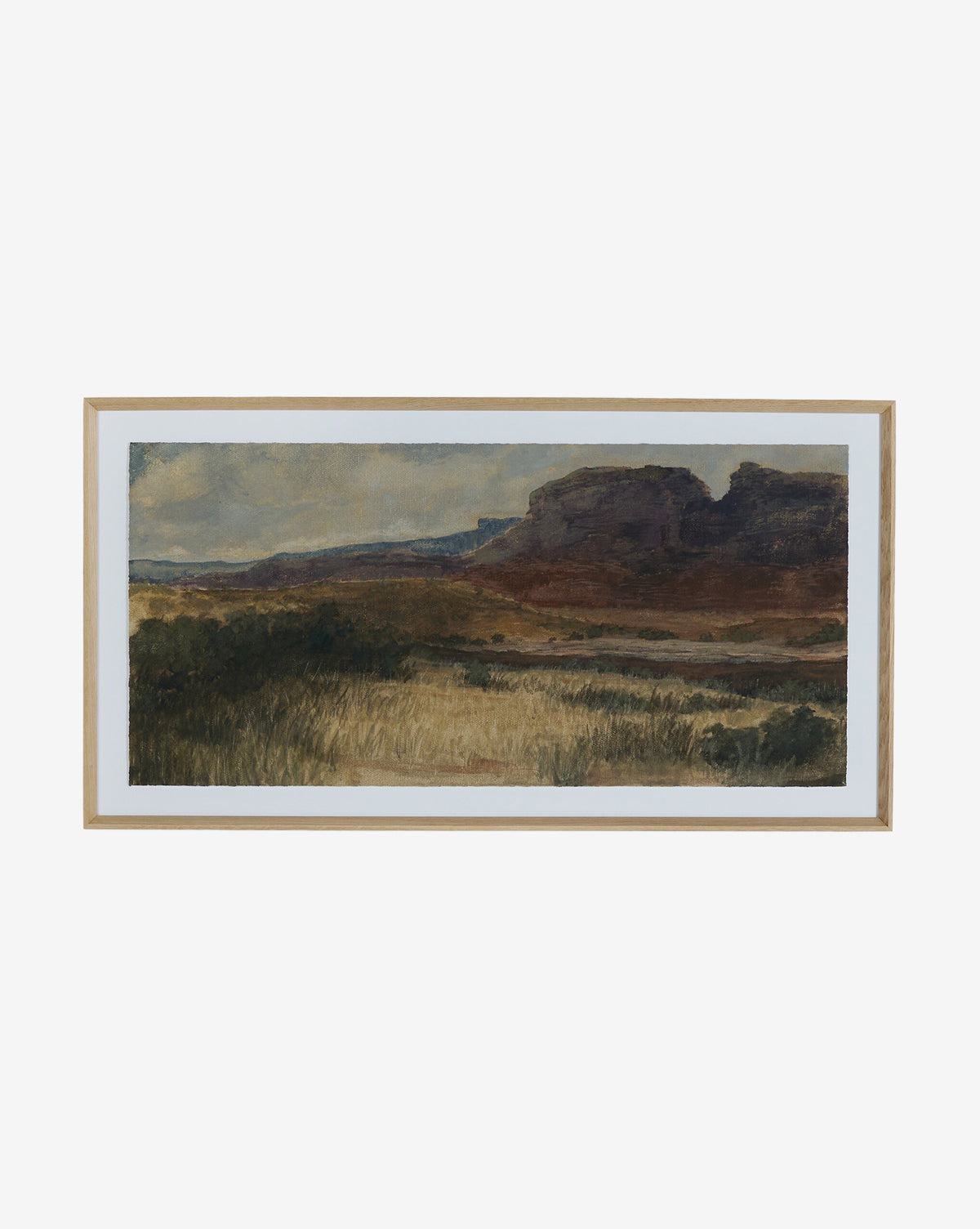 Desert Hues I by Aileen Fitzgerald is a framed white oak landscape print on fine art paper, showcasing grassy plains and rocky mesas under a cloudy sky in earthy greens, browns, and blues for vibrant, lasting detail, by Vendixs