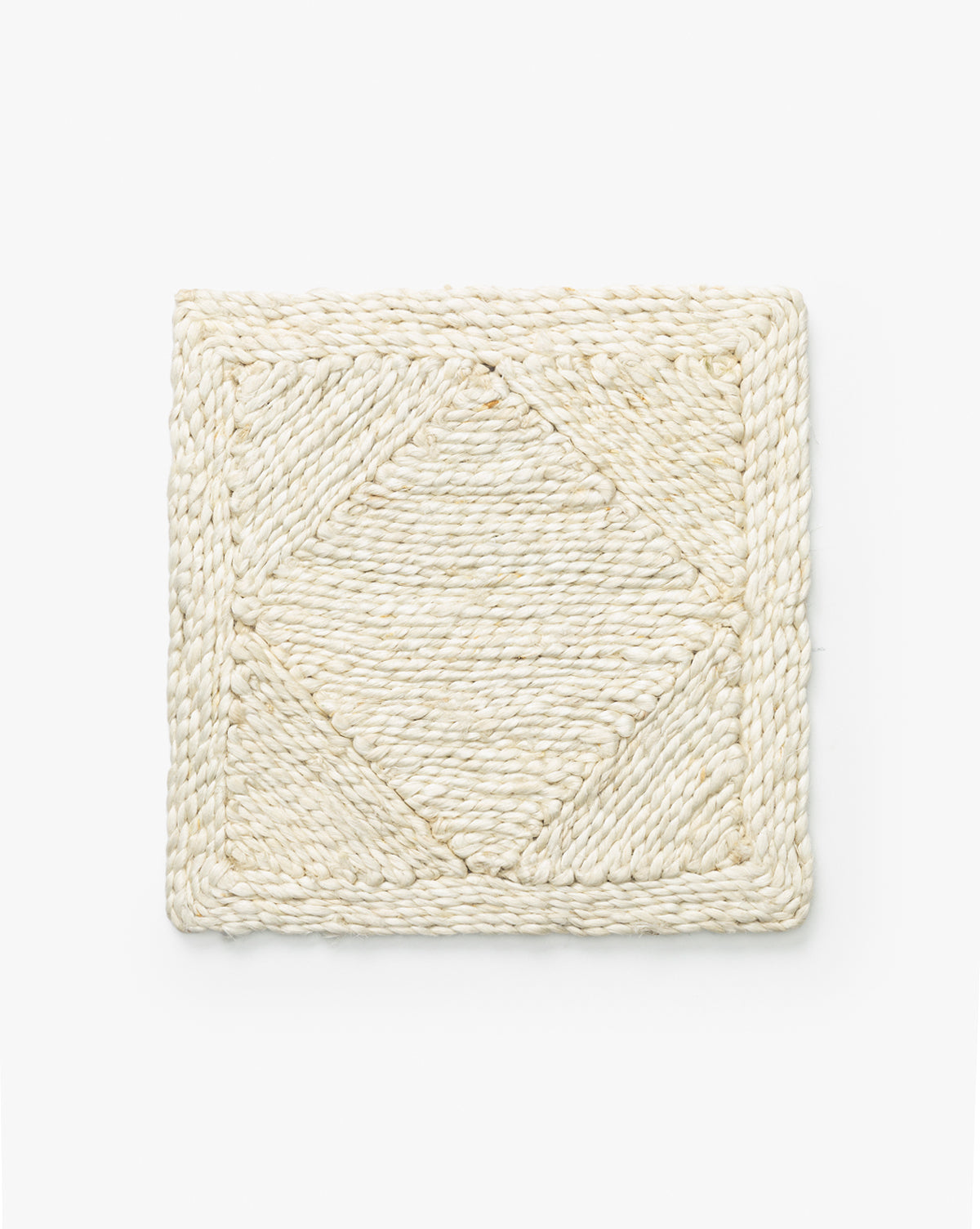 The Diamond Braided Bleached Jute Rug Swatch is a rectangular, off-white woven piece with a central geometric diamond pattern and braided border, evoking the look of a hand-woven rug, shown on a plain white background by McGee & Co.