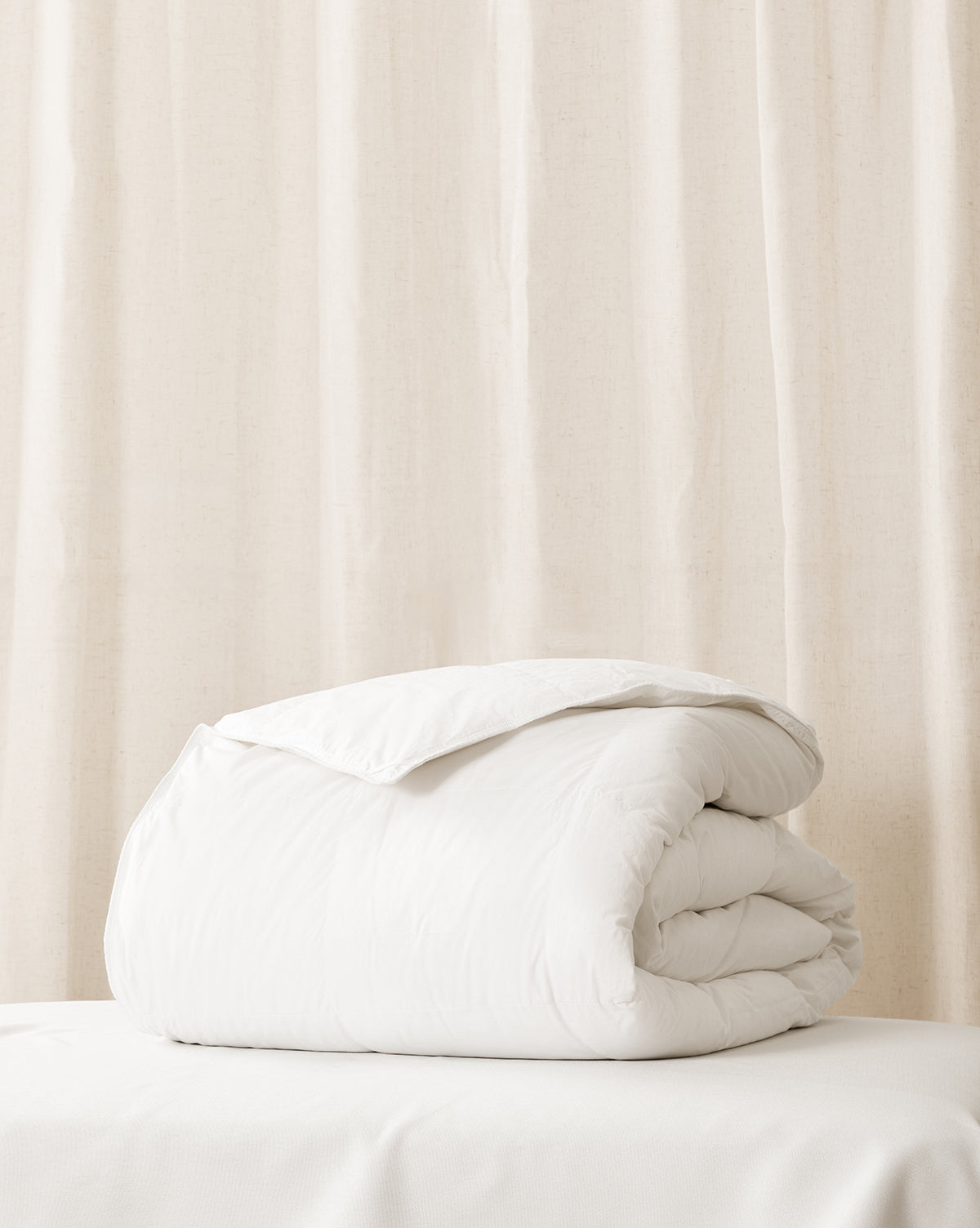 White down duvet insert on a bed with from Vendixs