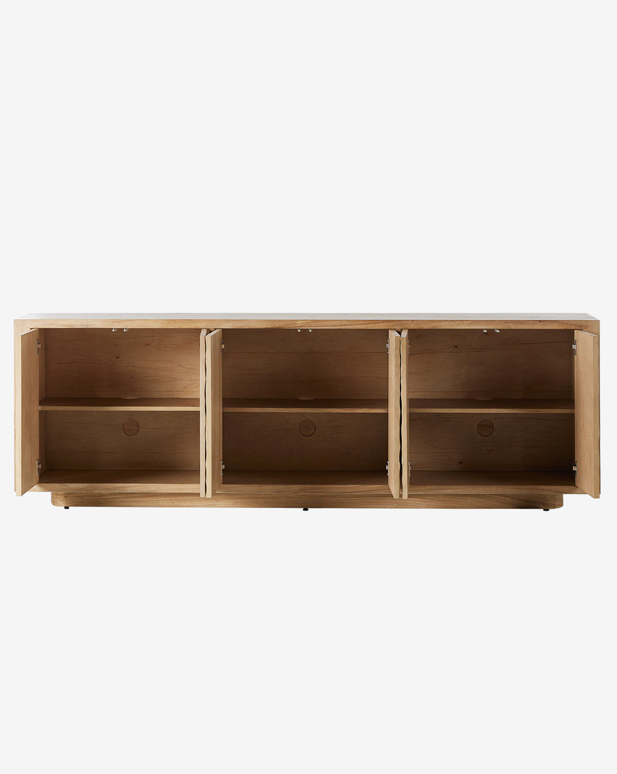 The Drayton Sideboard is a wooden storage cabinet with three open compartments, each with a shelf and textured doors. Shown against a plain white background, the entryway furniture has its doors open, revealing empty interiors by McGee & Co.