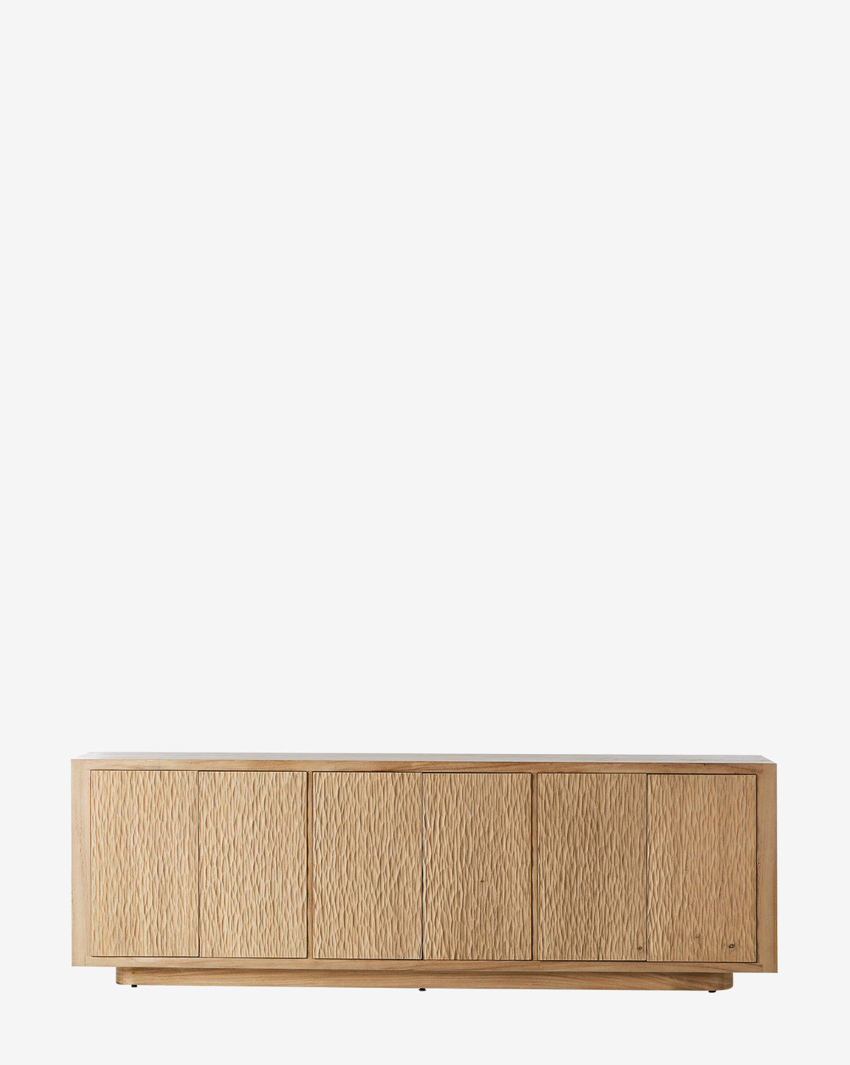 The Drayton Sideboard features a low, rectangular design with five textured doors and a natural light wood finish. Stylish and functional, it’s ideal for entryways and is shown here against a plain white background by McGee & Co.