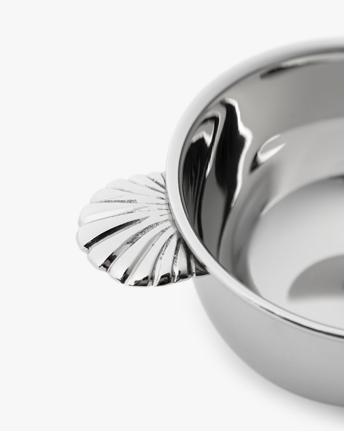 A close-up of the Durham Condiment Bowl with ornate handles and a decorative shell-shaped accent, displayed on a white background, by Vendixs