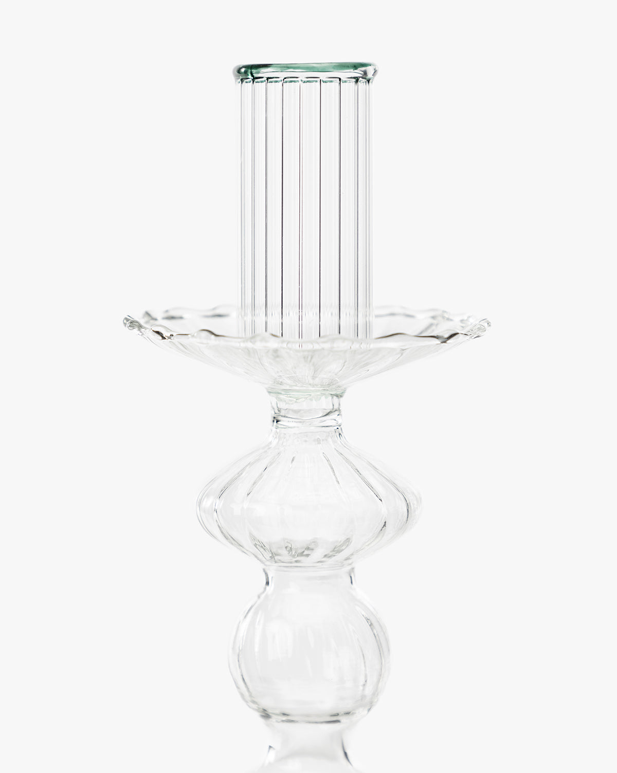The Vendixs x Loeffler Randall Effie Taper Holder is a clear glass piece with ribbed and scalloped detailing, offering elegant decoration against a plain white background, by Vendixs