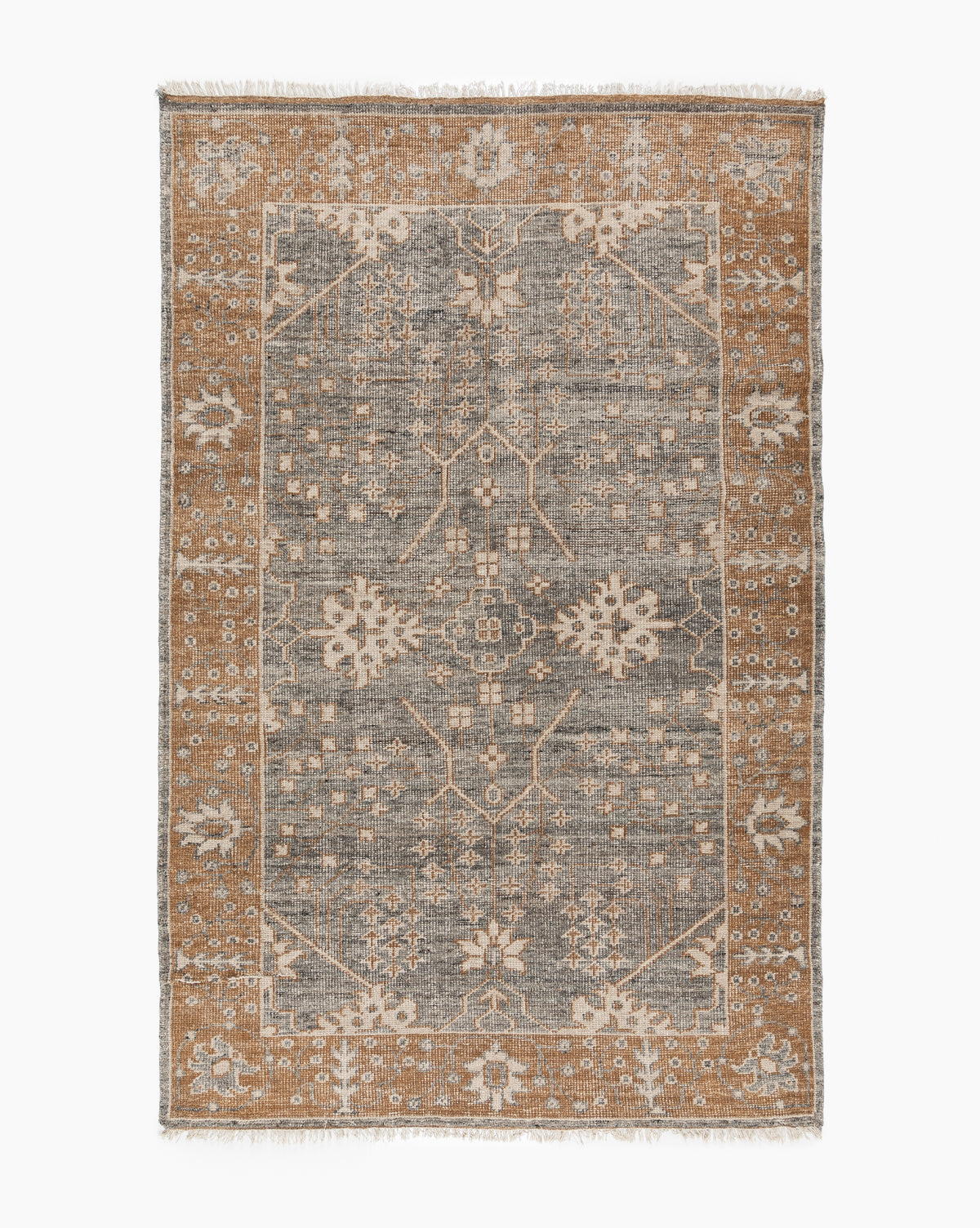 The Elison Hand-Knotted Wool Rug features a gray central field with intricate floral and geometric patterns, a wide tan border with similar artisan details, and fringed edges that highlight its traditional textile charm, by Vendixs