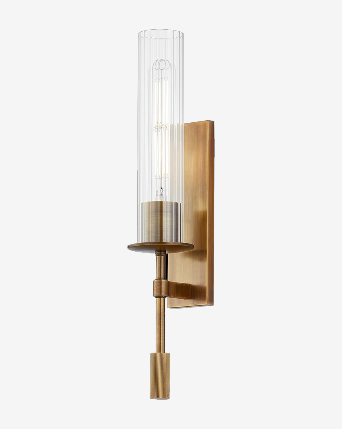 The Elton Sconce by Troy Lighting features a patina brass finish, cylindrical fluted glass shade, vertical rectangular backplate, and exposed bulb for a modern look. Vendixs