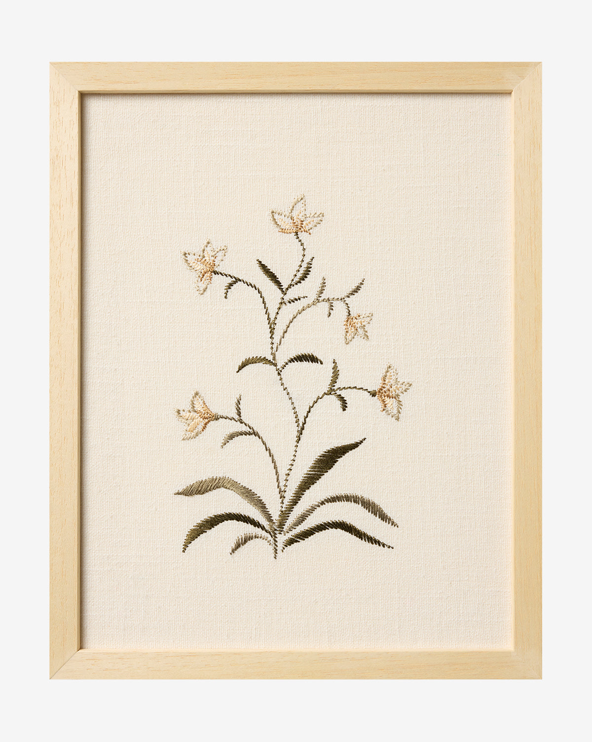 Embroidered Pixie Flowers features five beige embroidered flowers with green leaves on cream fabric, framed in light wood for a charming botanical wall art accent, by Vendixs