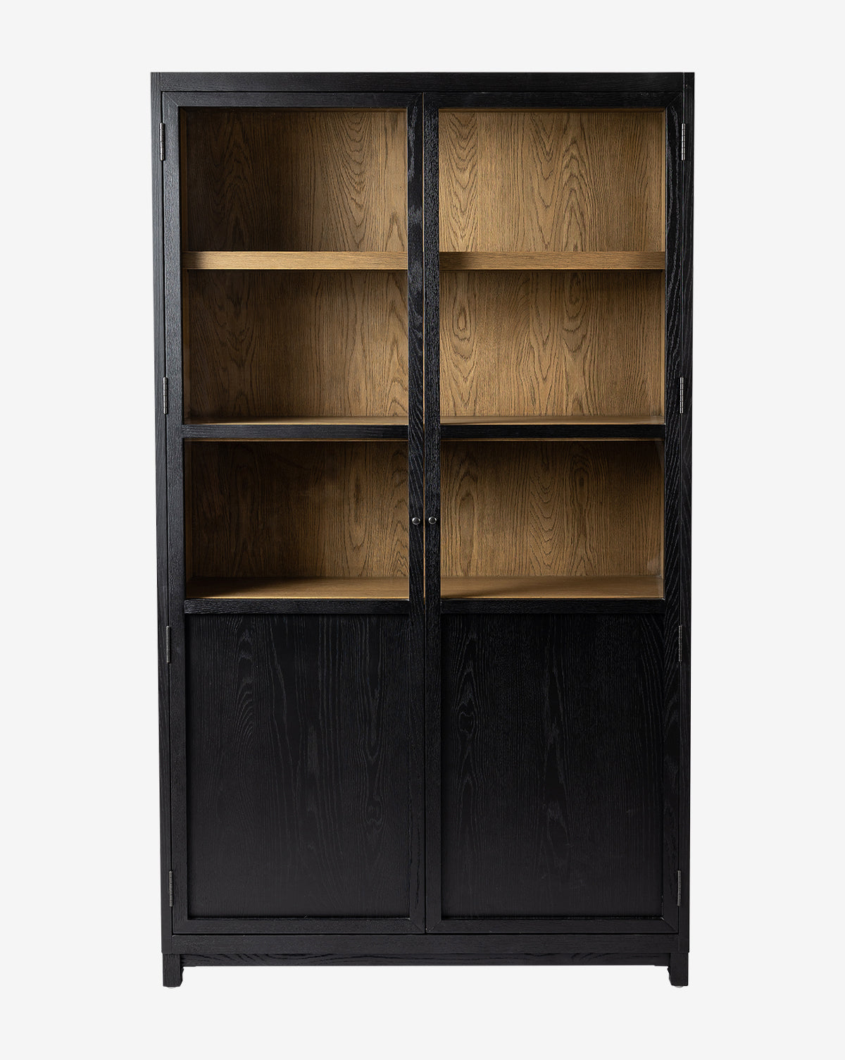 The Emrys Cabinet is a tall, black wood piece with glass and oak doors on top showing three shelves, and solid lower doors for storage, all set against a plain white background, by Vendixs